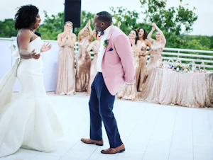 Groom Dancing With Bride In Strapless Sleek Wedding Dress Named Mitchell By Maggie Sottero