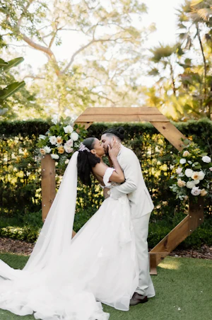 Bride wearing Lettie by Rebecca Ingram kissing her husband