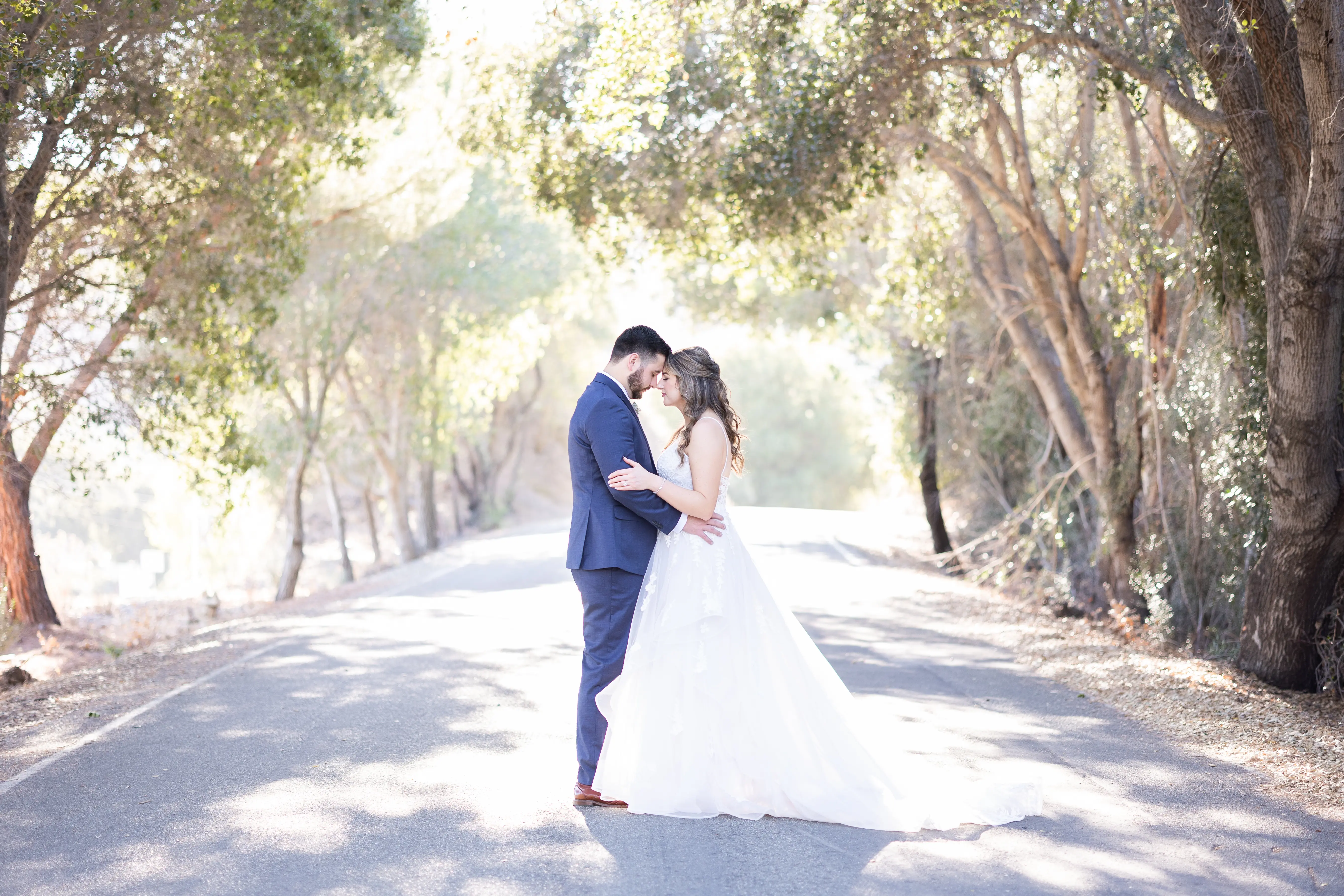 Groom With Bride Wearing Lace Wedding Dress With Tiered Tulle Skirt Lettie By Rebecca Ingram