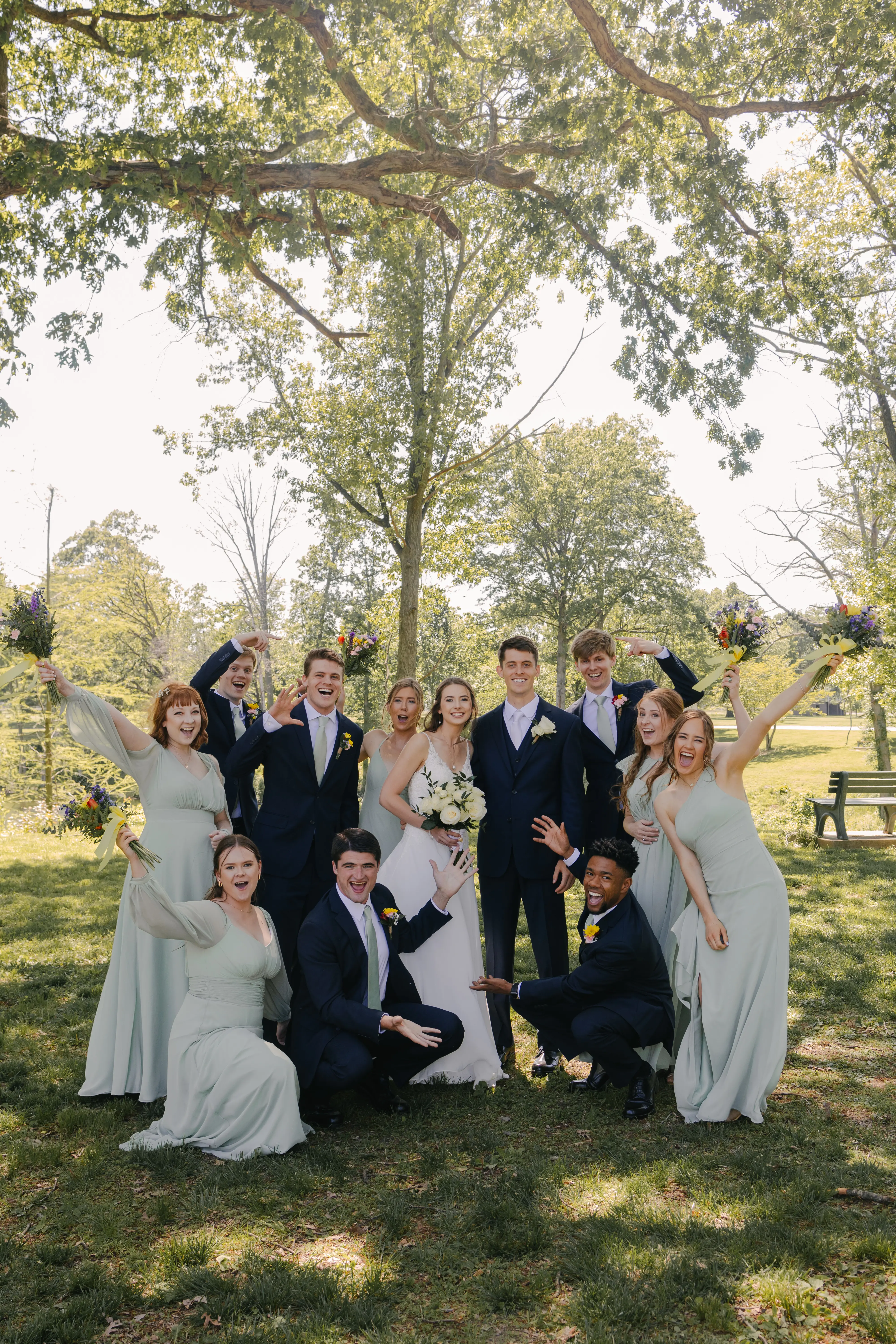 Bride wearing Charlotte by Rebecca Ingram with her wedding party