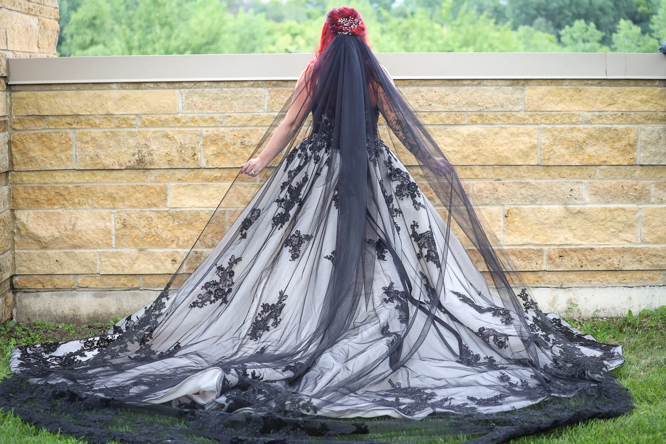 Bride Wearing Royal-Inspired Ball Gown Wedding Dress In Black Lace Called Norvinia By Sottero And Midgley
