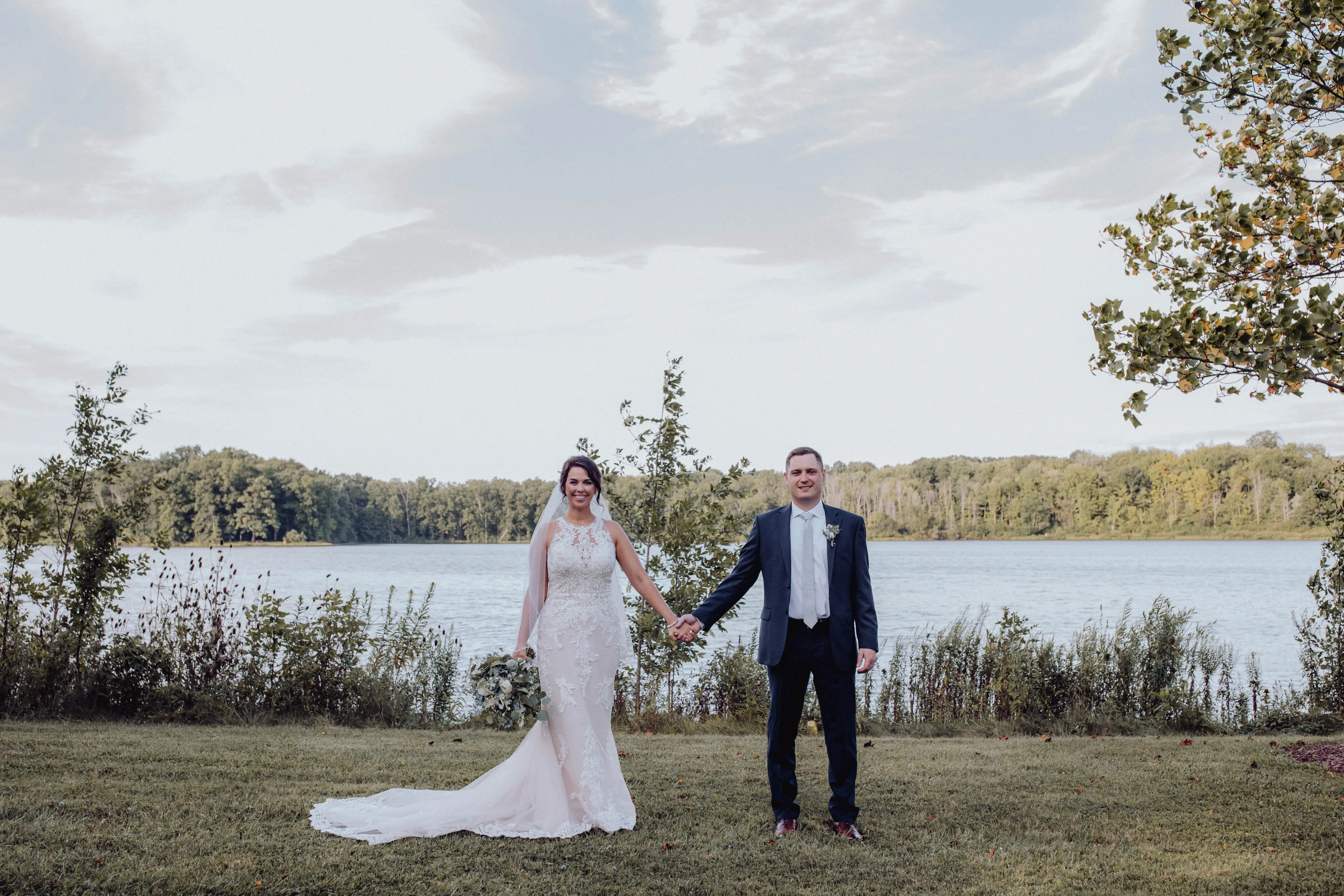 Bride with groom wearing budget friendly fit and flare wedding dress
