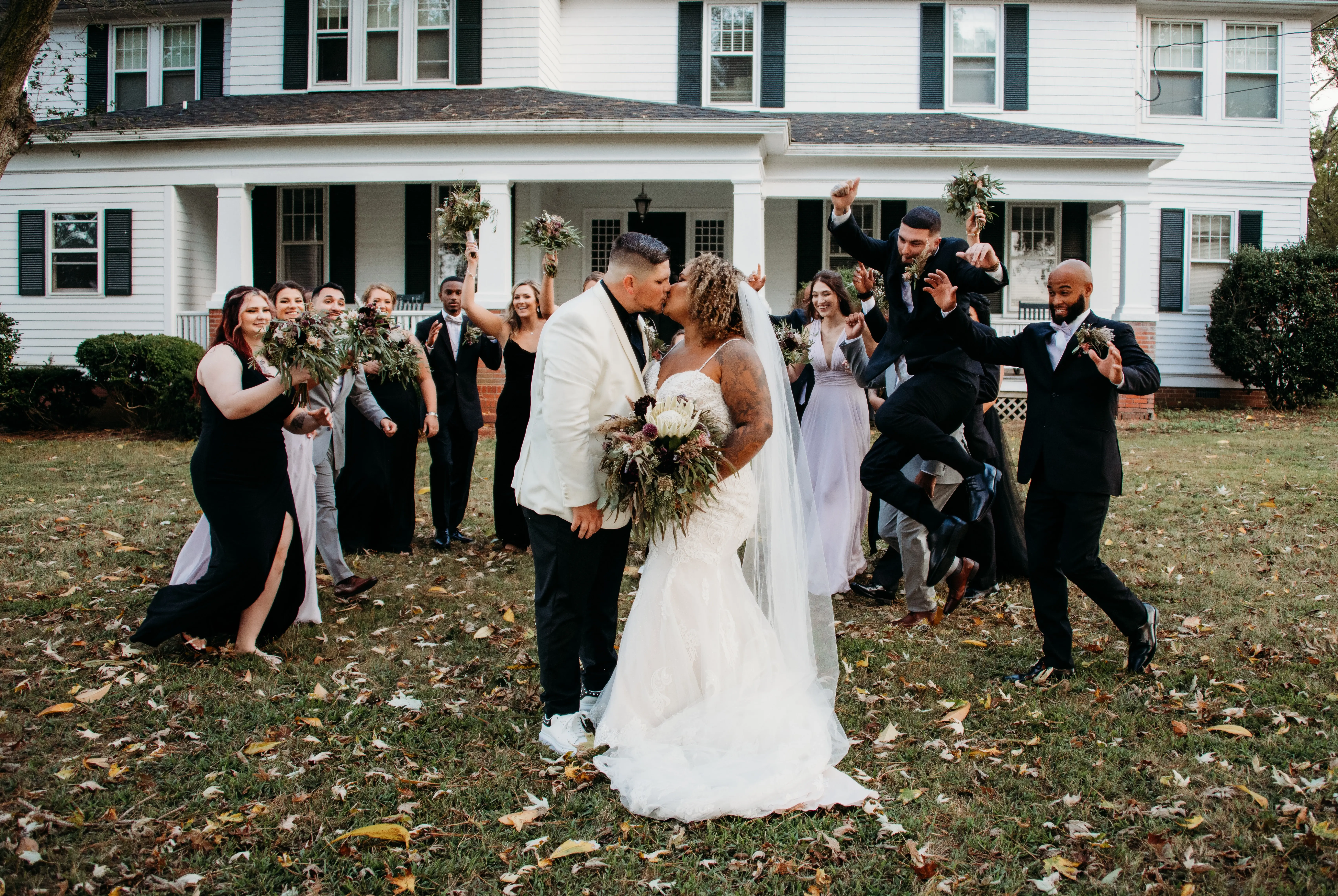 Wedding Party with Groom Kissing Real Bride in Breaded Sparkly Lace Fit-and-Flare Dress with Scalloped Illusion Lace Train Called Fiona by Maggie Sottero