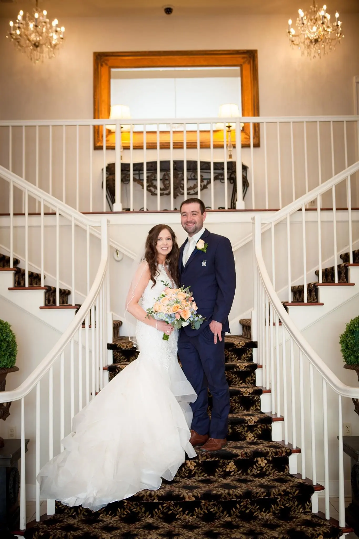 Bride with groom wearing organza mermaid wedding dress