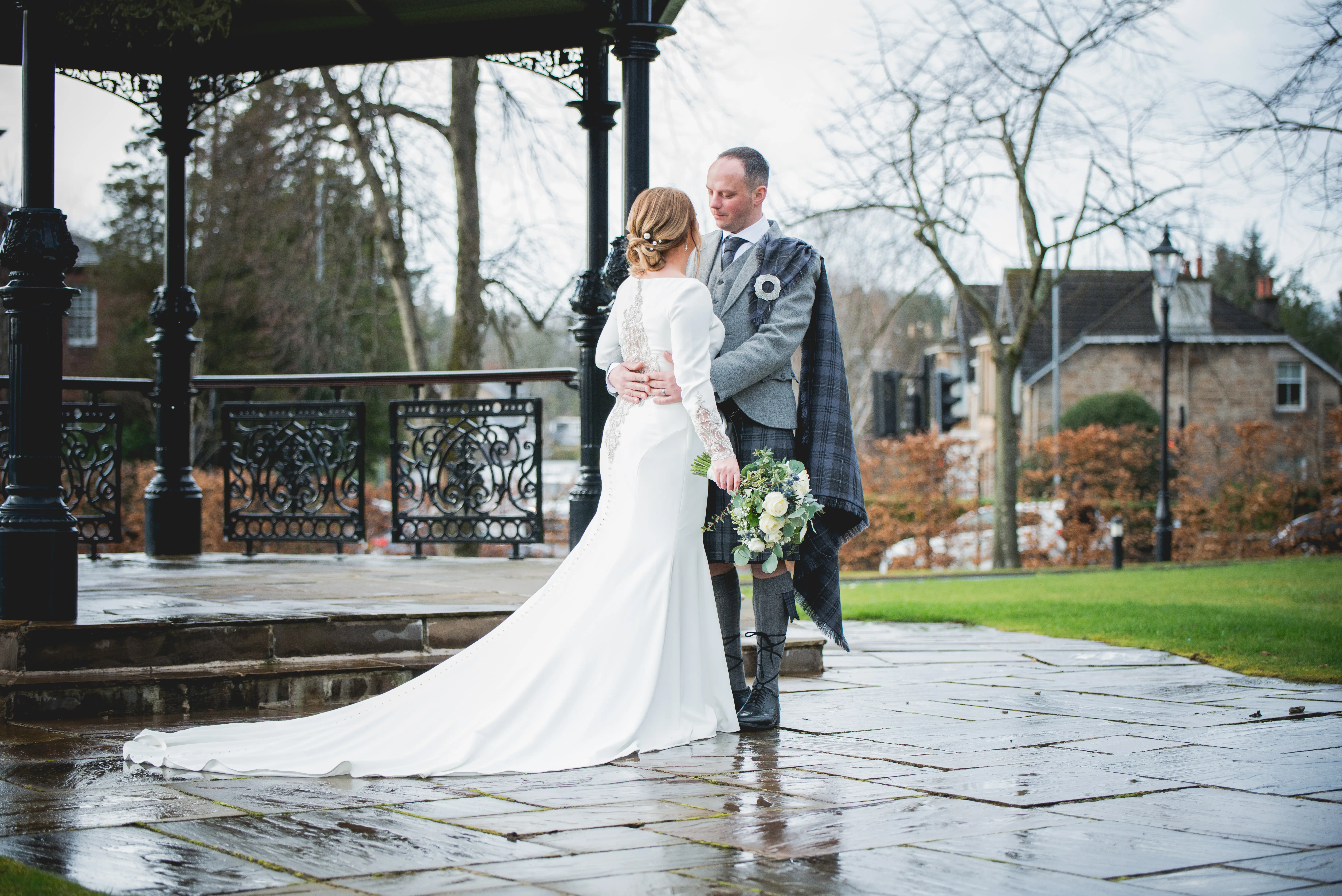 Groom with Bride in Crepe Fit-and-Flare Wedding Dress with Beaded Illusion Embroidery Featuring Swarovski Crystals Called Aston by Sottero & Midgley