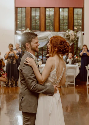 Bride Wearing Boho Sheath Wedding Dress Called Lorraine By Rebecca Ingram Dancing With The Groom At The Reception
