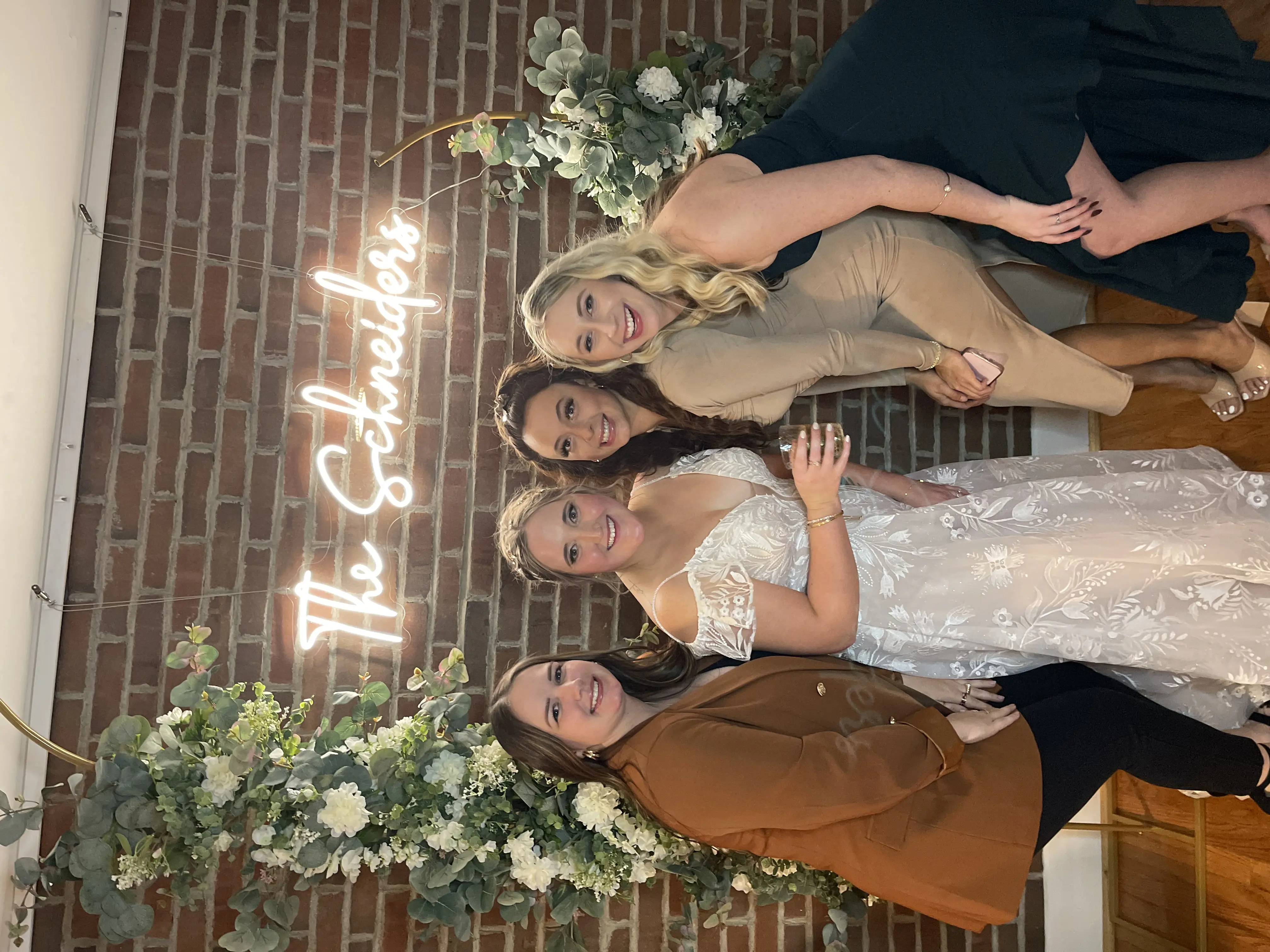 Bride wearing Keisha wedding dress by Maggie Sottero with friends