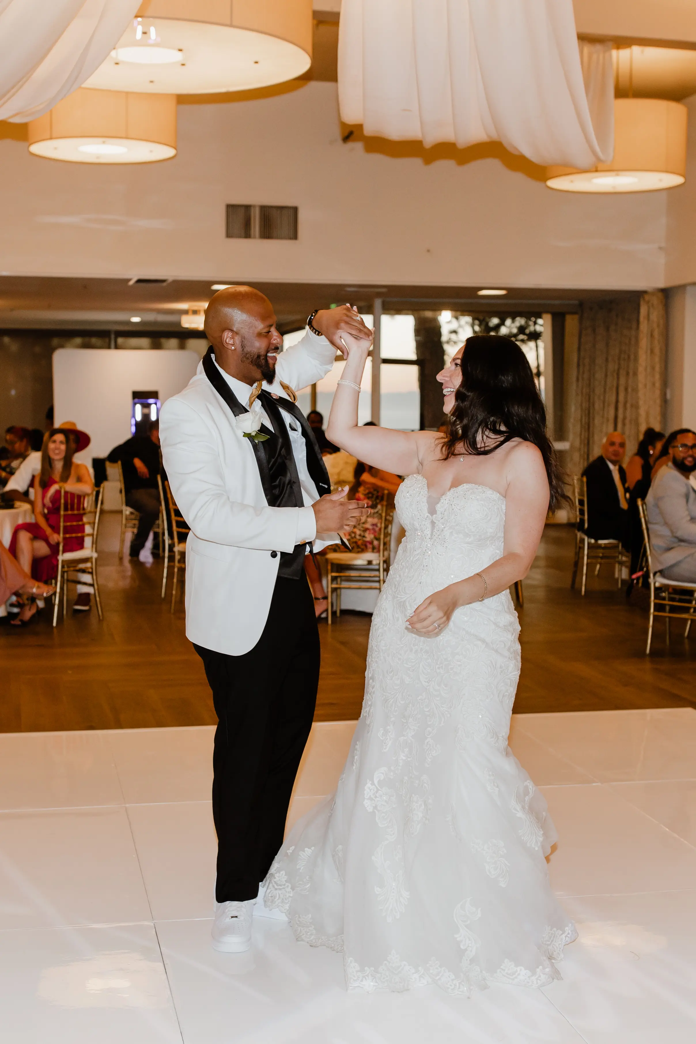 Bride Wearing Lace Wedding Dress Called Fiona By Maggie Sottero At Reception With Groom In White Suit