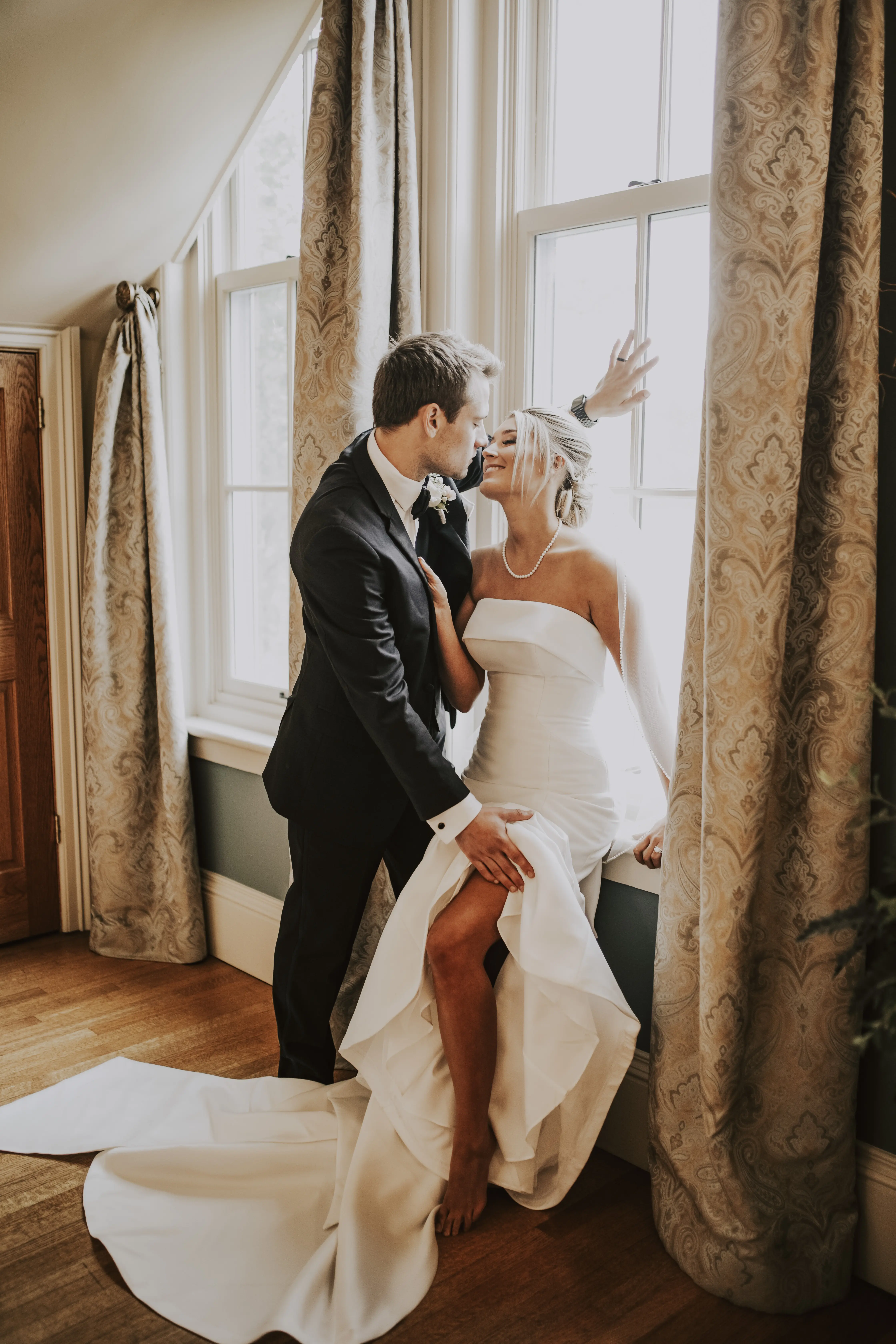 Bride wearing Mitchell wedding dress by Maggie Sottero with her husband