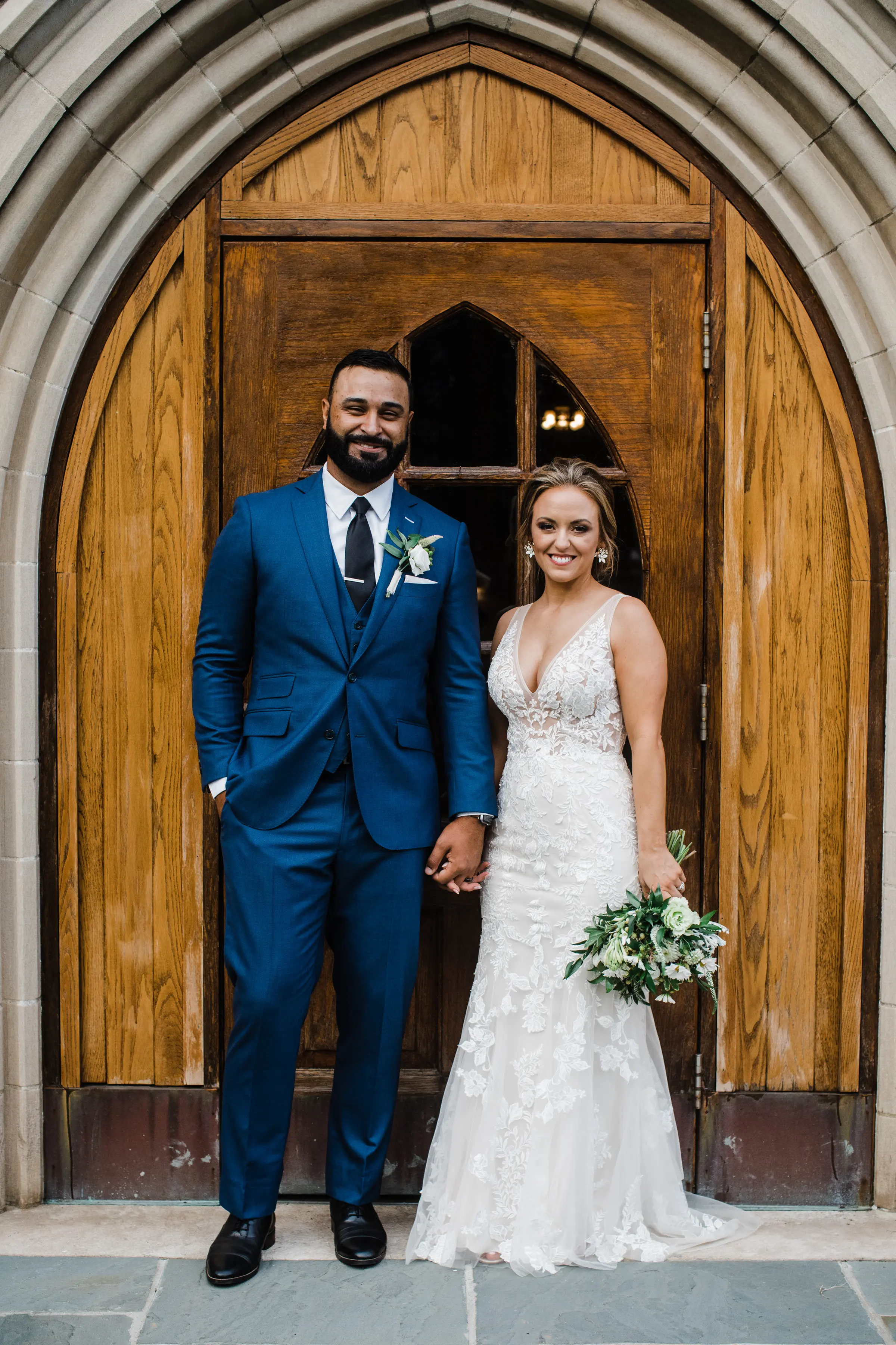 Bride and Groom Holding Hands Wearing Bridal Gown Called Greenley by Maggie Sottero