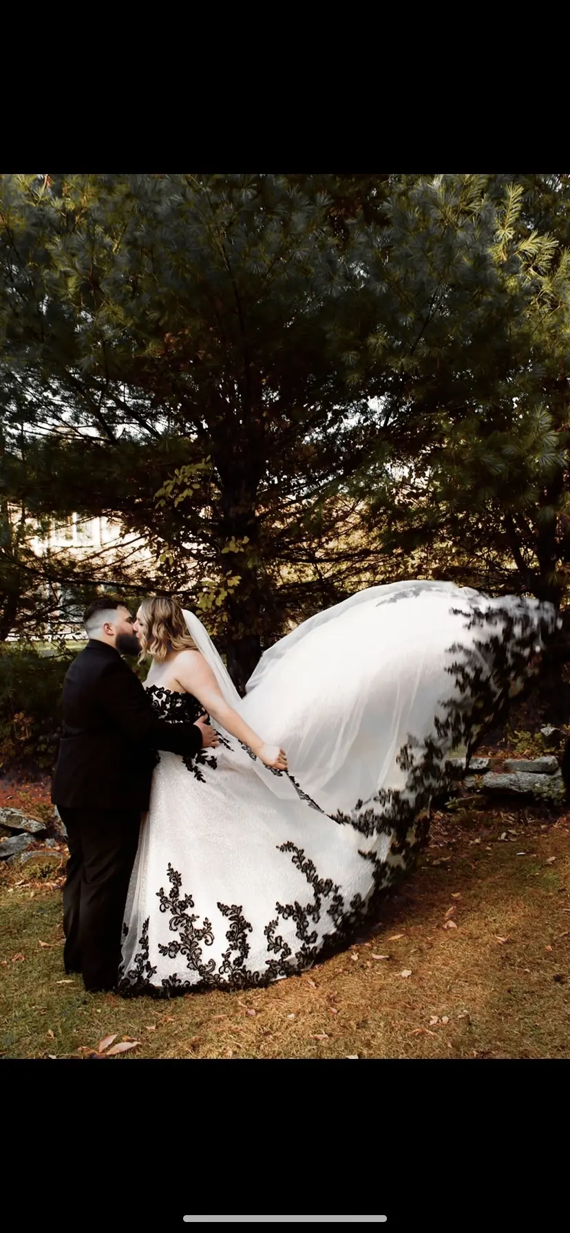 Bride Wearing Black Lace Wedding Dress Called Tristyn By Maggie Sottero Kissing Groom