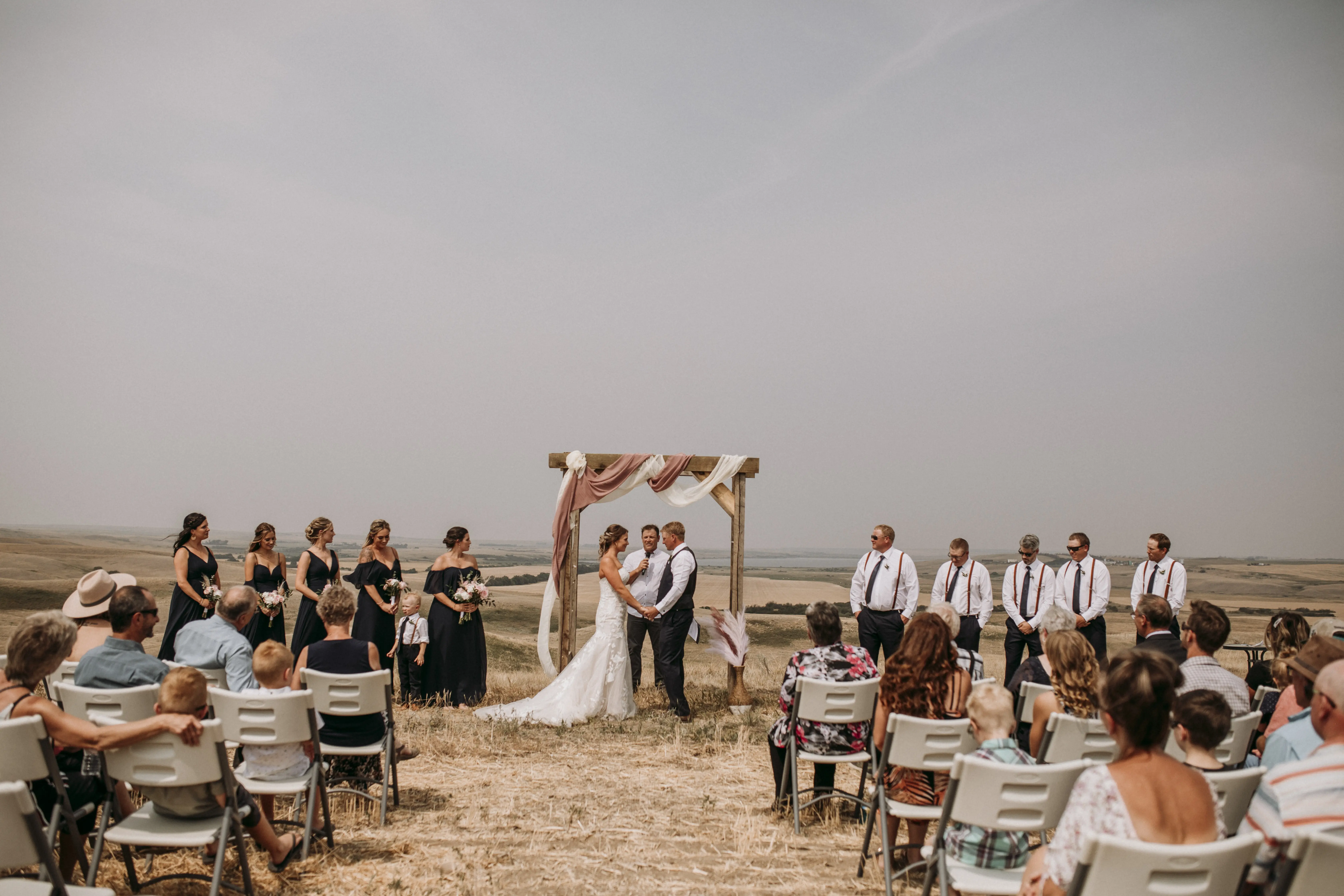 Bride with groom wearing strapless mermaid wedding dress
