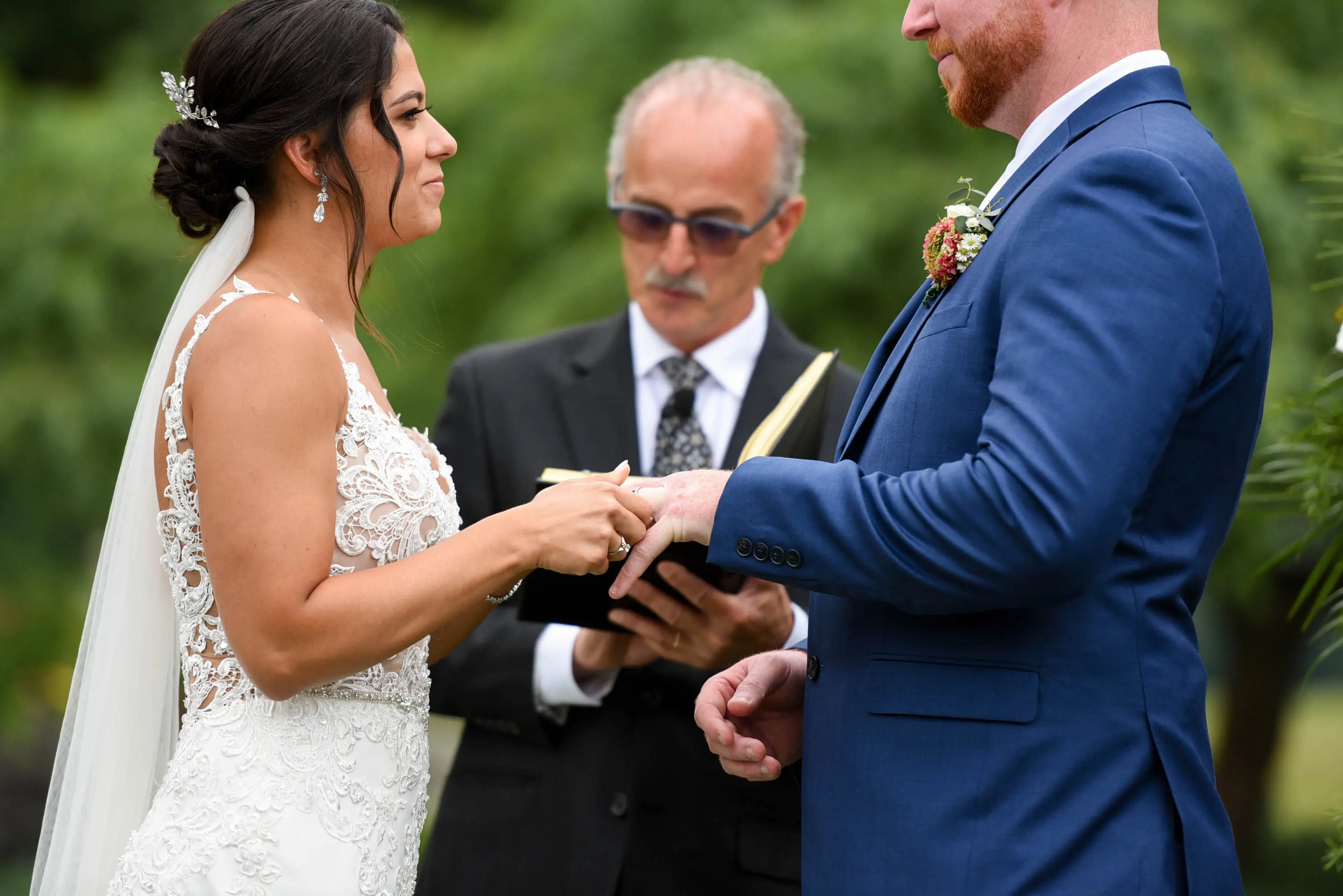Bride with groom wearing crepe sheath wedding dress