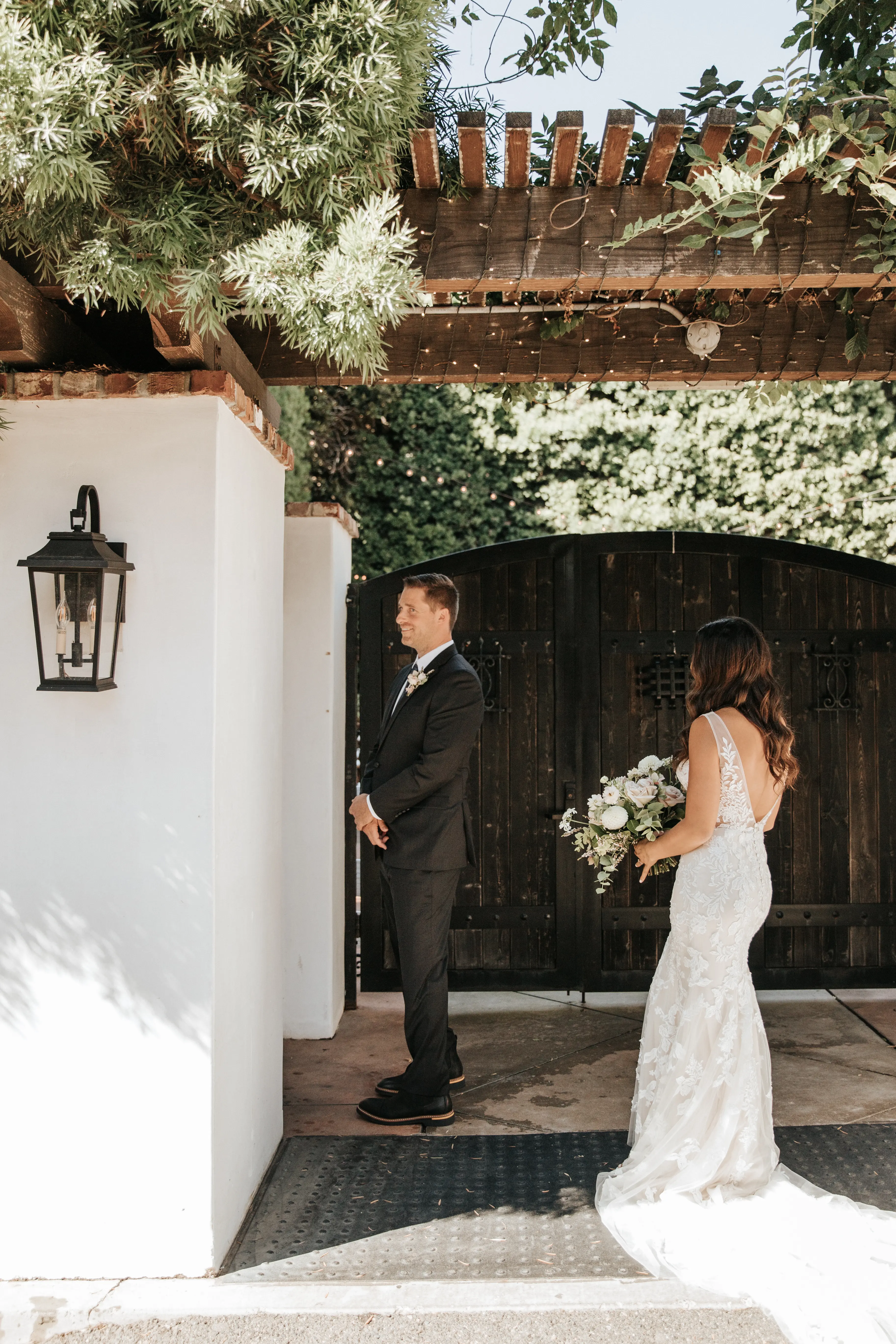 Bride with groom wearing floral fit and flare wedding dress