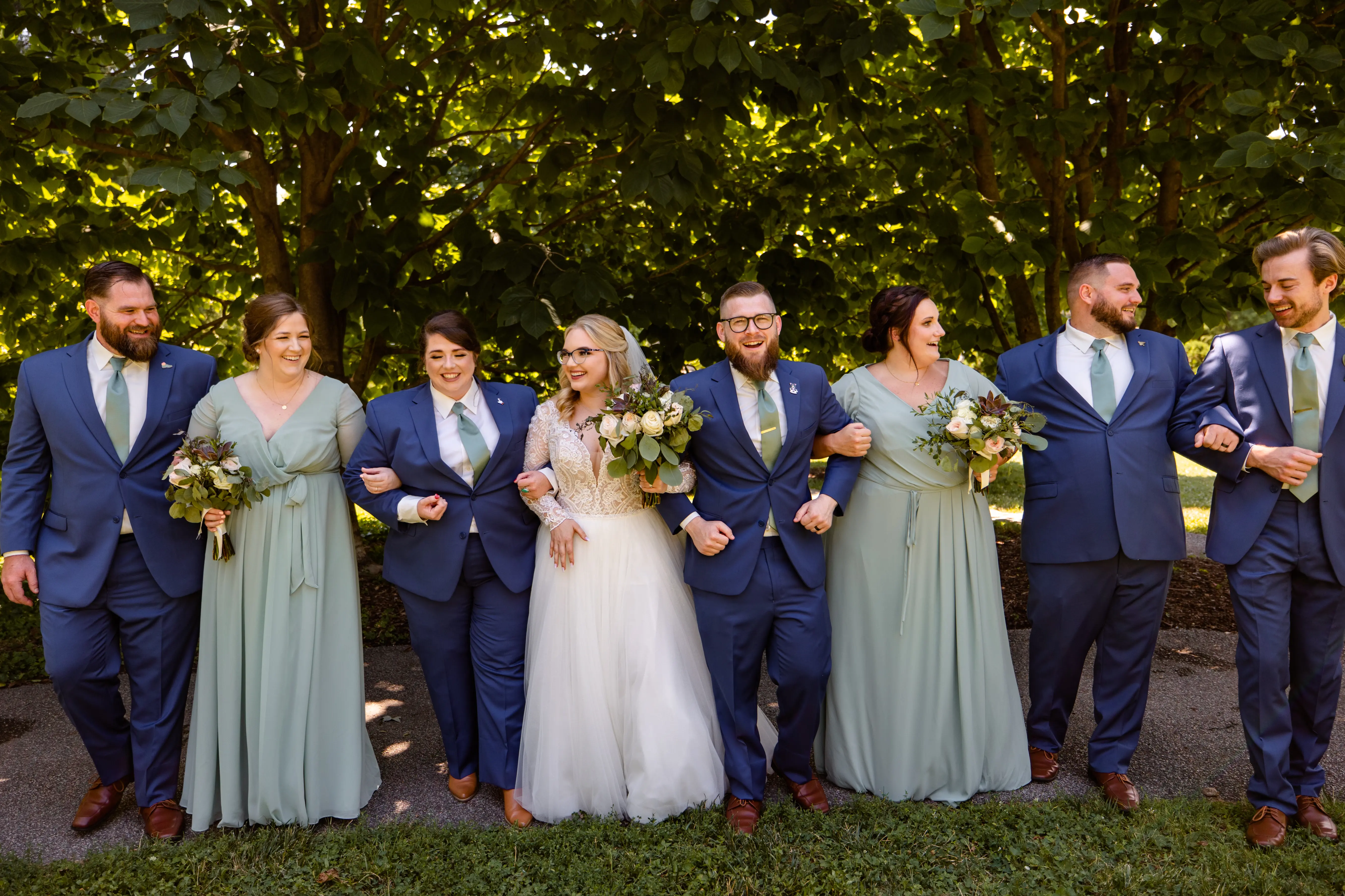 Bride In Plunging Lace Illusion Neckline Called Mallory Dawn By Maggie Sottero With Bridal Party