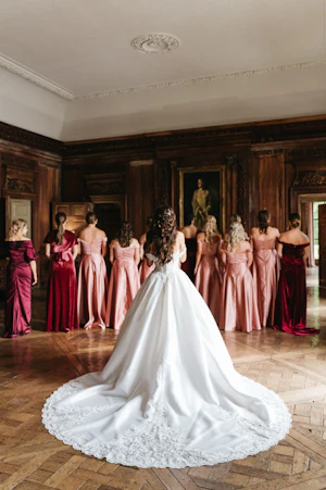 Bride In Satin Ballgown Wedding Dress Called Kimora By Sottero And Midgley With Bridesmaids In Reds And Pink