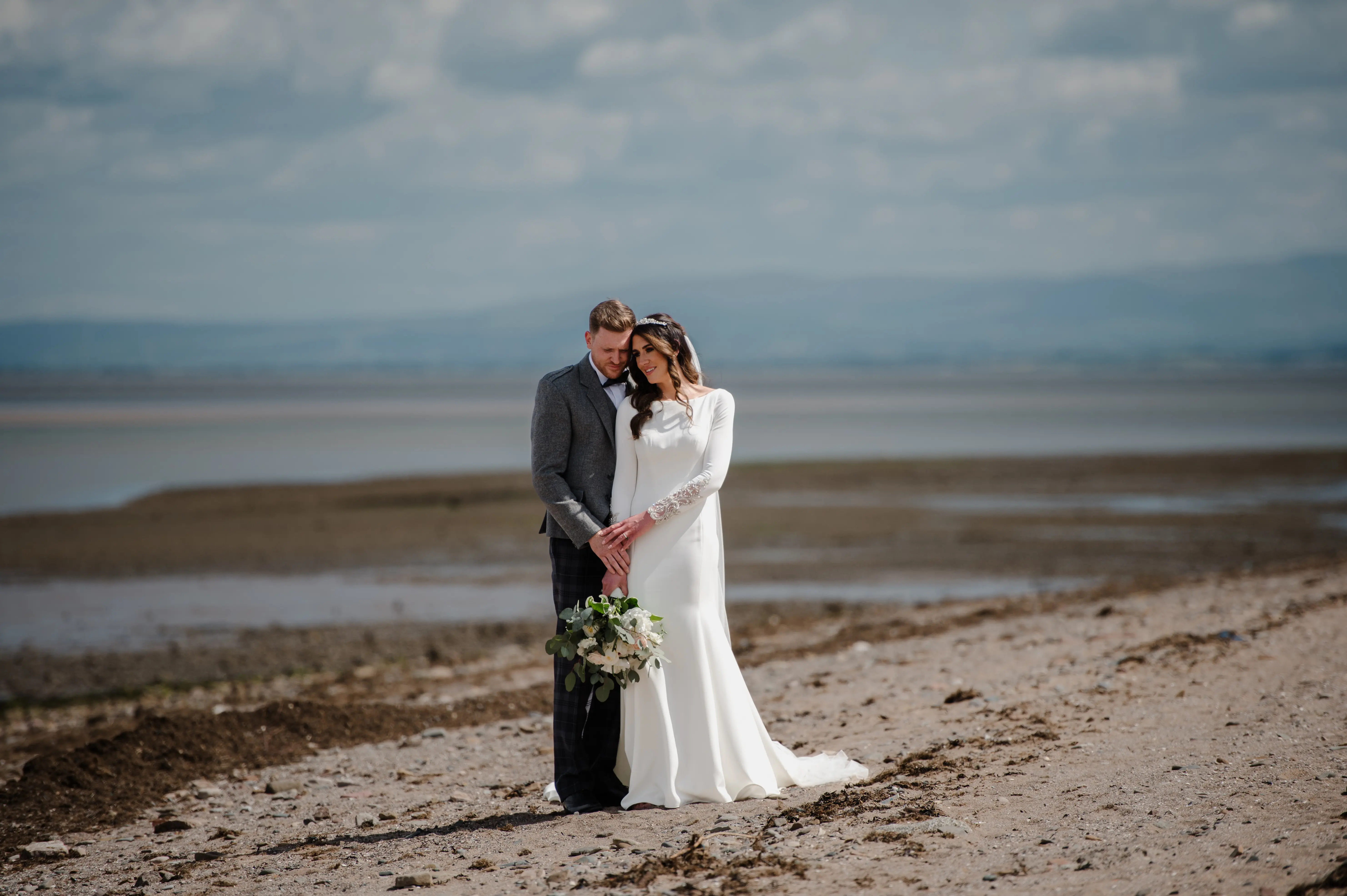 Real Bride in Crepe Fit-and-Flare Wedding Dress with a Statement Back of Beaded Illusion Embroidery Featuring Swarovski Crystals Called Aston by Sottero & Midgely