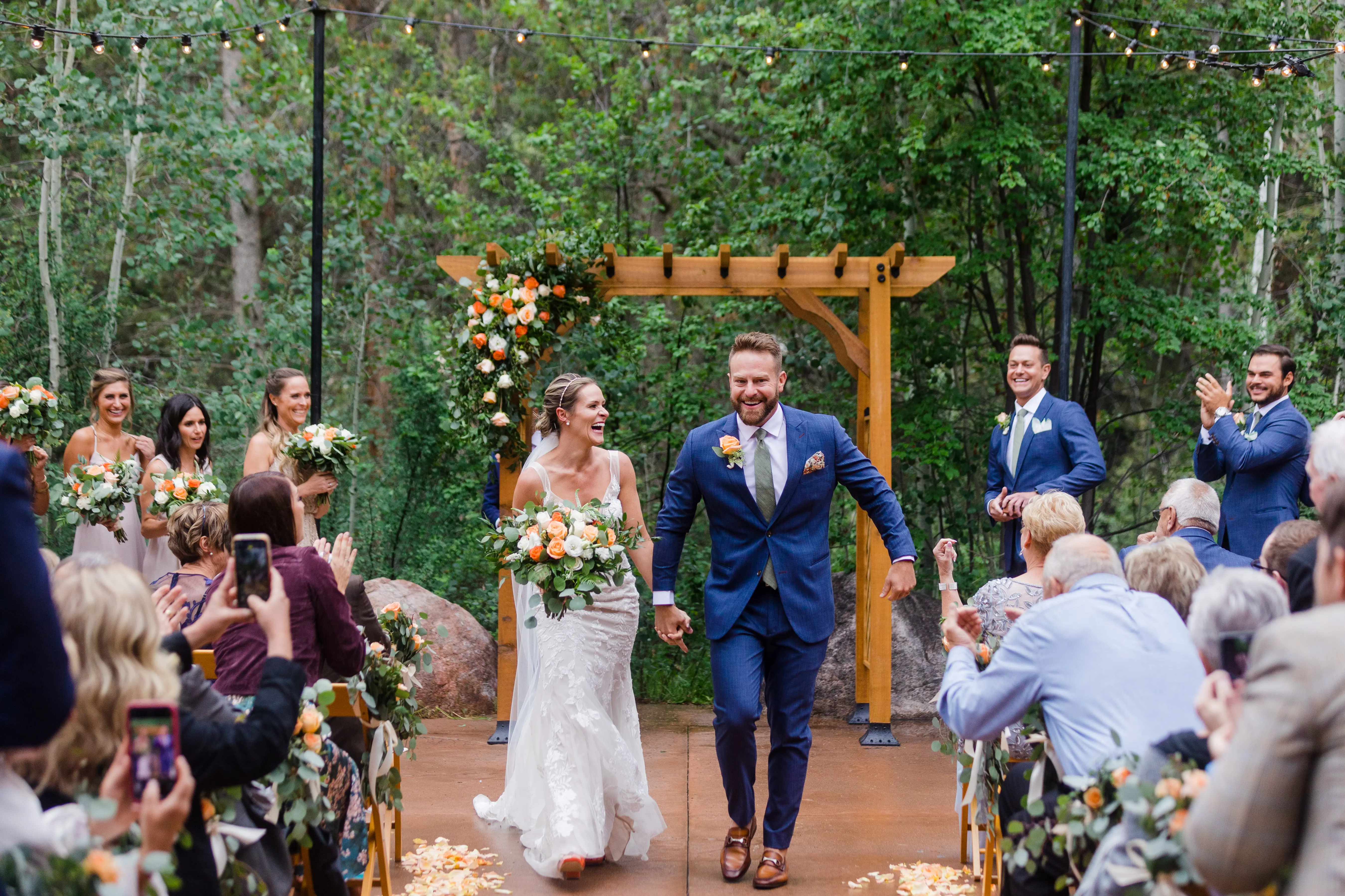 Bride and groom looking excited as they are pronounced Mr and Mrs.