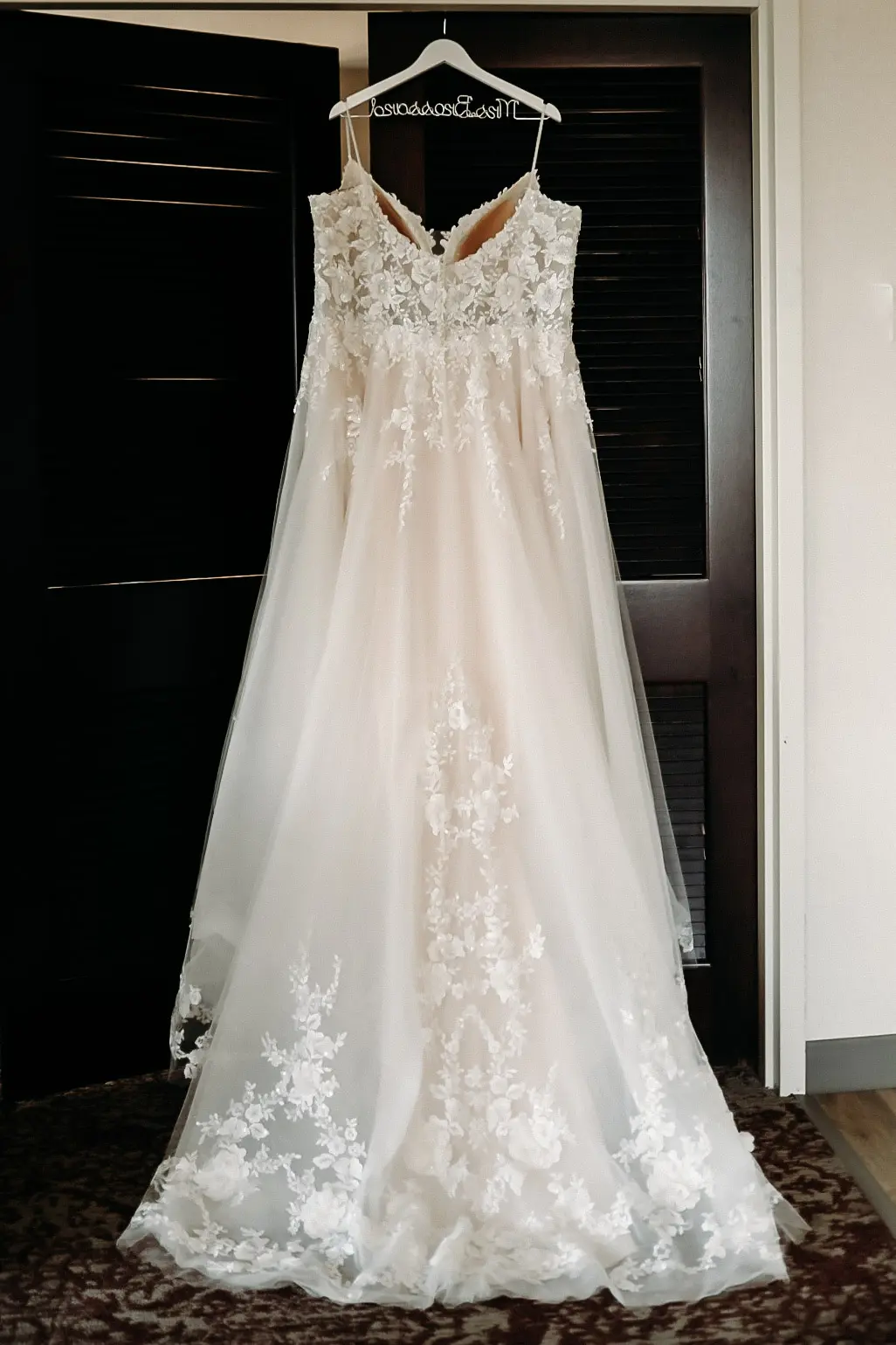 Pia wedding dress by Maggie Sottero hanging up