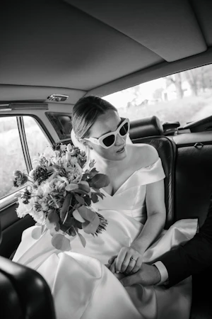 Bride Wearing Off The Shoulder Fit And Flare Josie By Rebecca Ingram