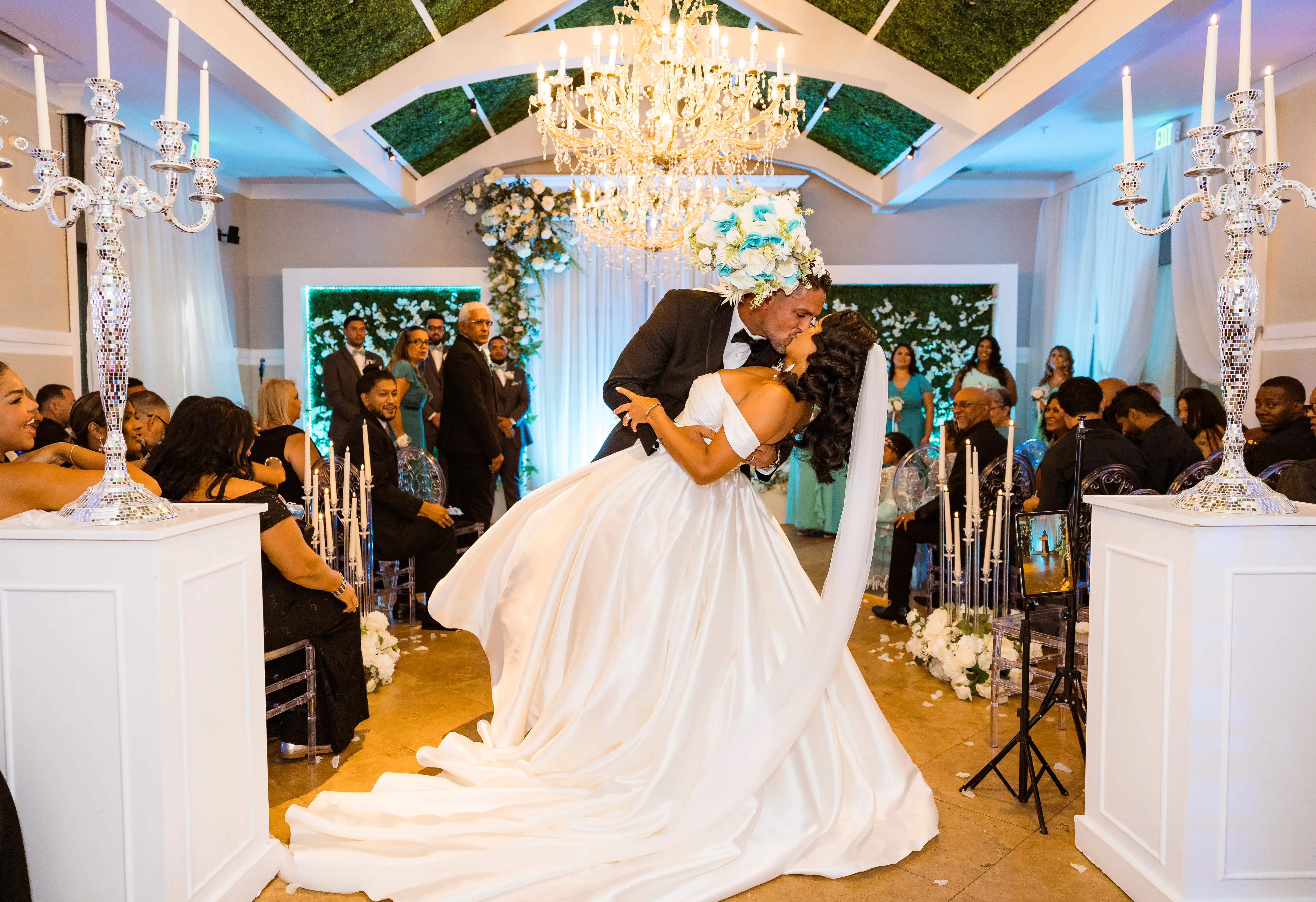 Bride wearing Zinaida by Maggie Sottero kissing her husband at their ceremony
