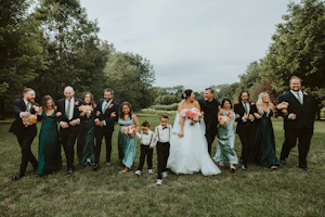 Bride Wearing Sparkly Ballgown Wedding Dress Called Shasha By Sottero And Midgley With Her Family And Bridal Party