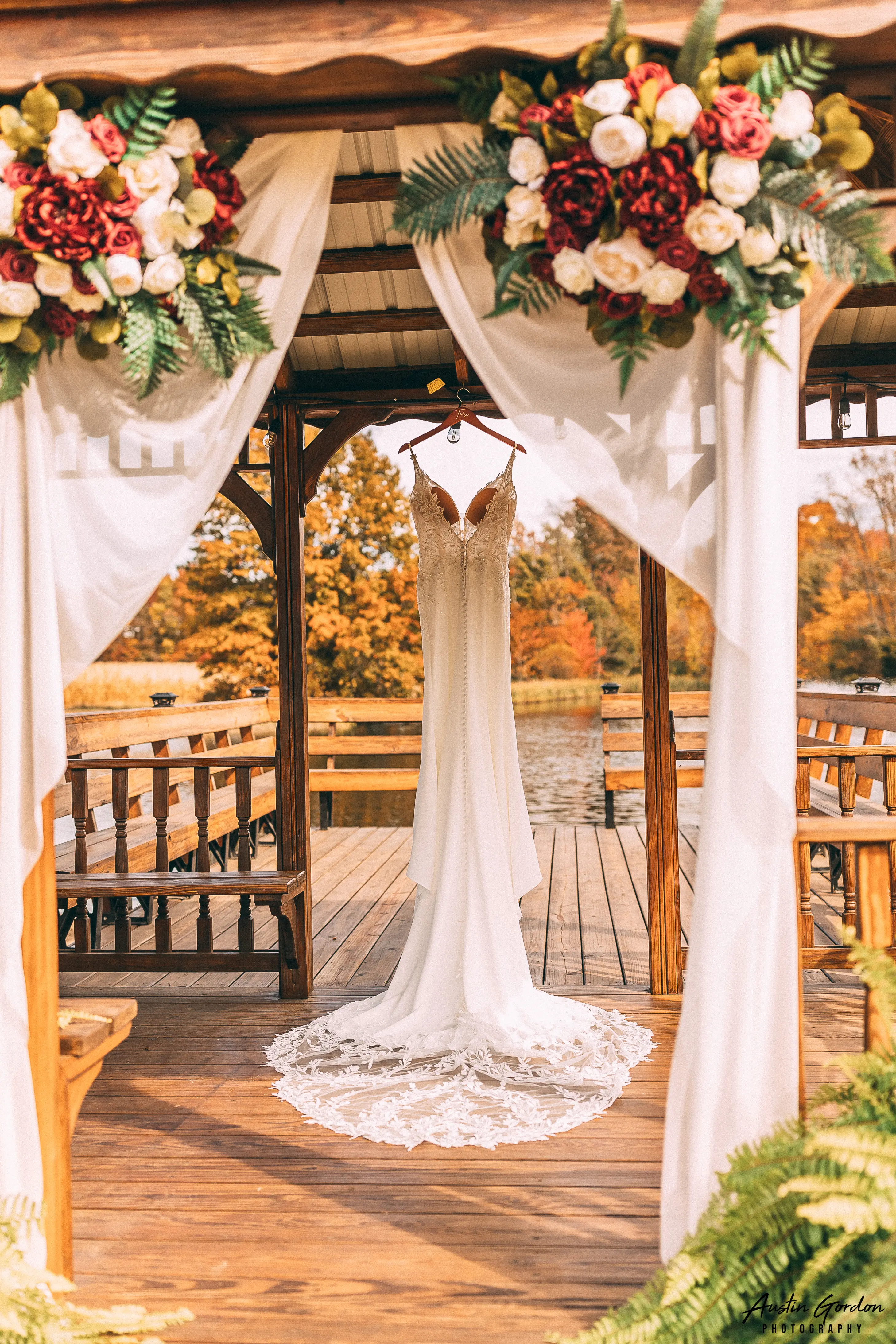 Crepe Sheath Wedding Dress Called Alda By Rebecca Ingram Hanging On A Dock