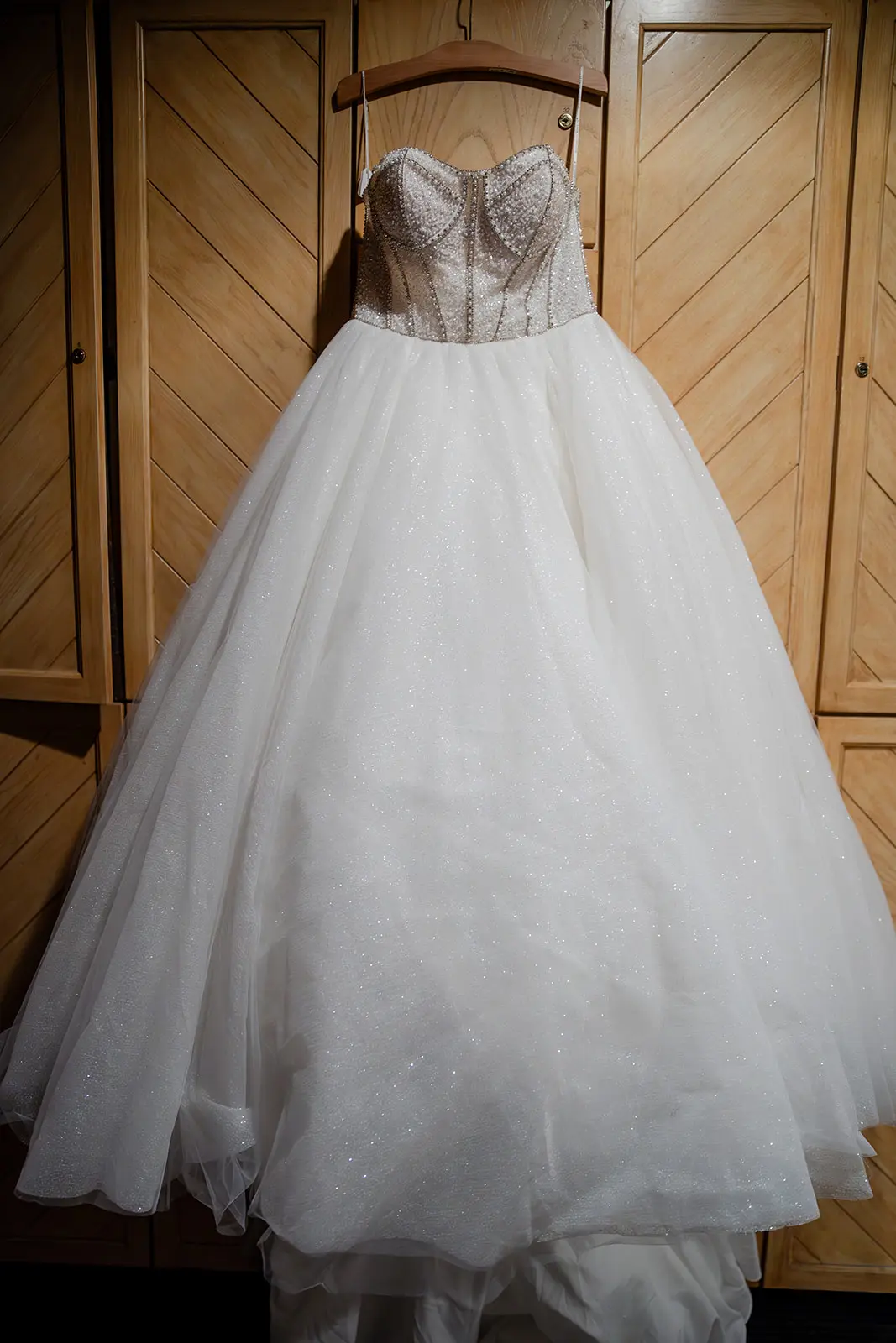 Elton wedding dress by Sottero and Midgley hanging up