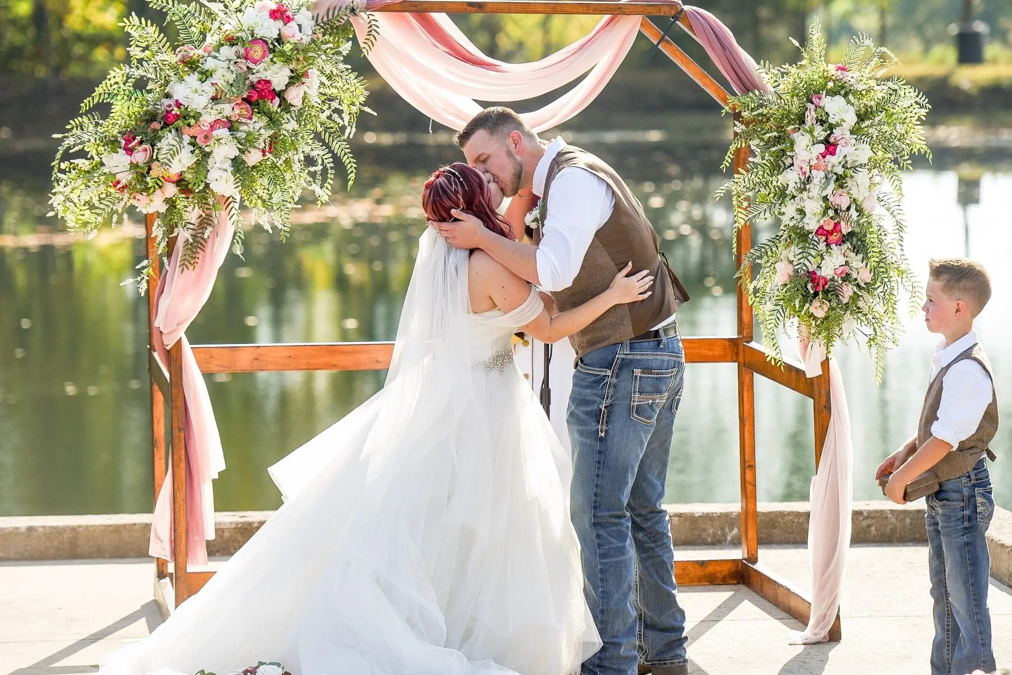 Bride Wearing Sparkly Princess Ballgown Wedding Dress Called Yasmin By Maggie Sottero Kissing Groom After Ceremony