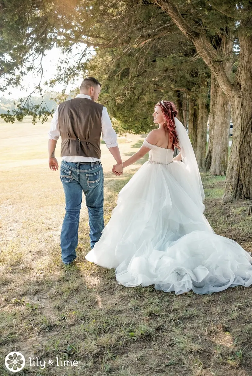 Bride Wearing Sparkly Princess Ballgown Wedding Dress Called Yasmin By Maggie Sottero Holding Hands With Groom
