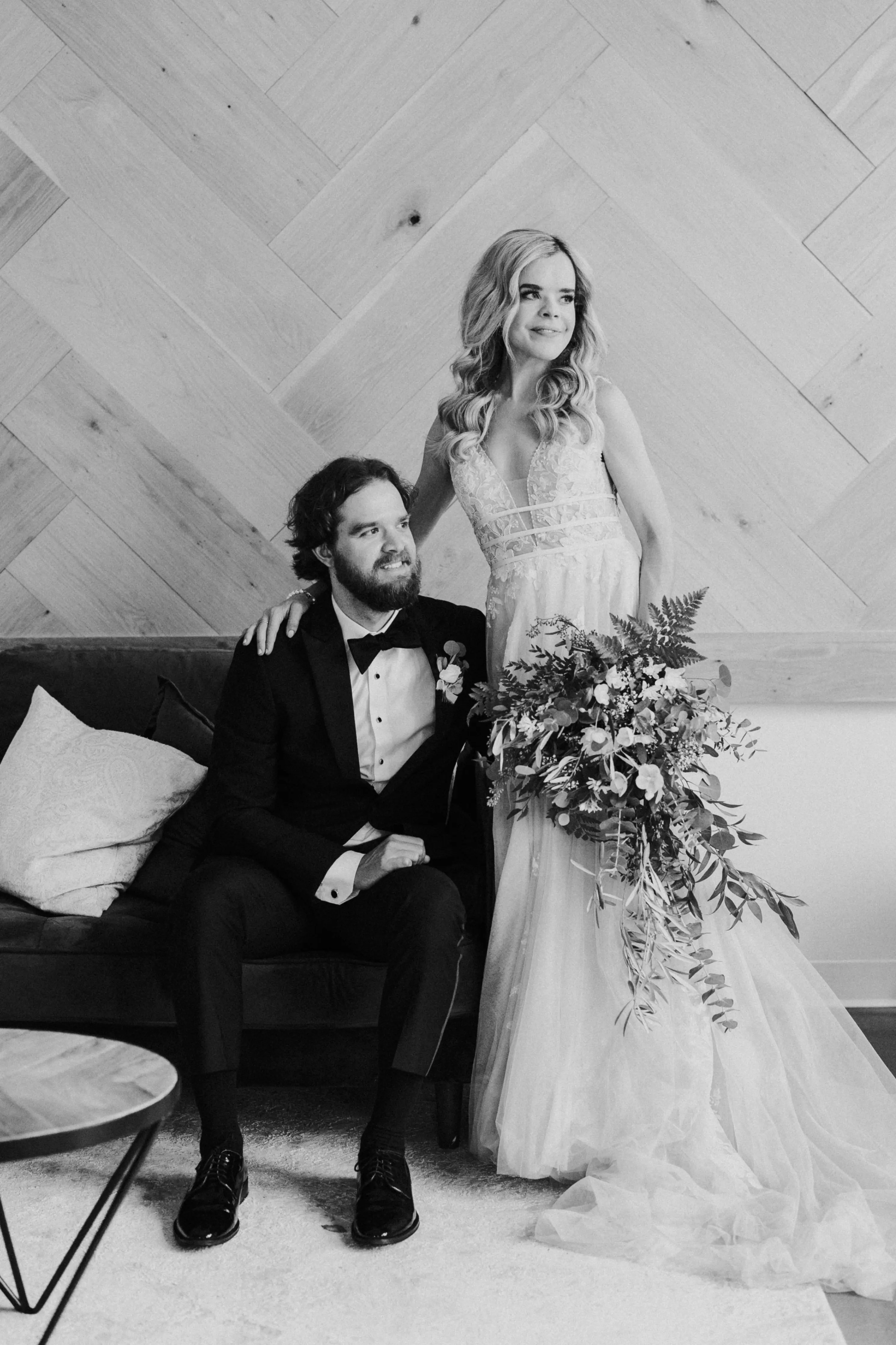 Groom With Bride Wearing Plunging Lace Illusion Wedding Dress Called Raelynn By Rebecca Ingram