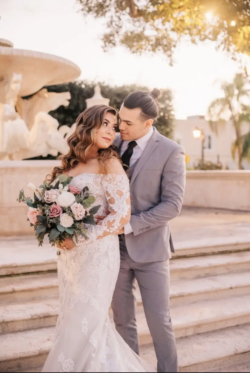 Bride Wearing Lace Sheath Wedding Dress Called Fiona By Maggie Sottero Looking At Groom