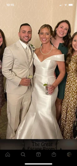 Bride Wearing Simple Fit And Flare Wedding Dress Called Josie By Rebecca Ingram With Groom