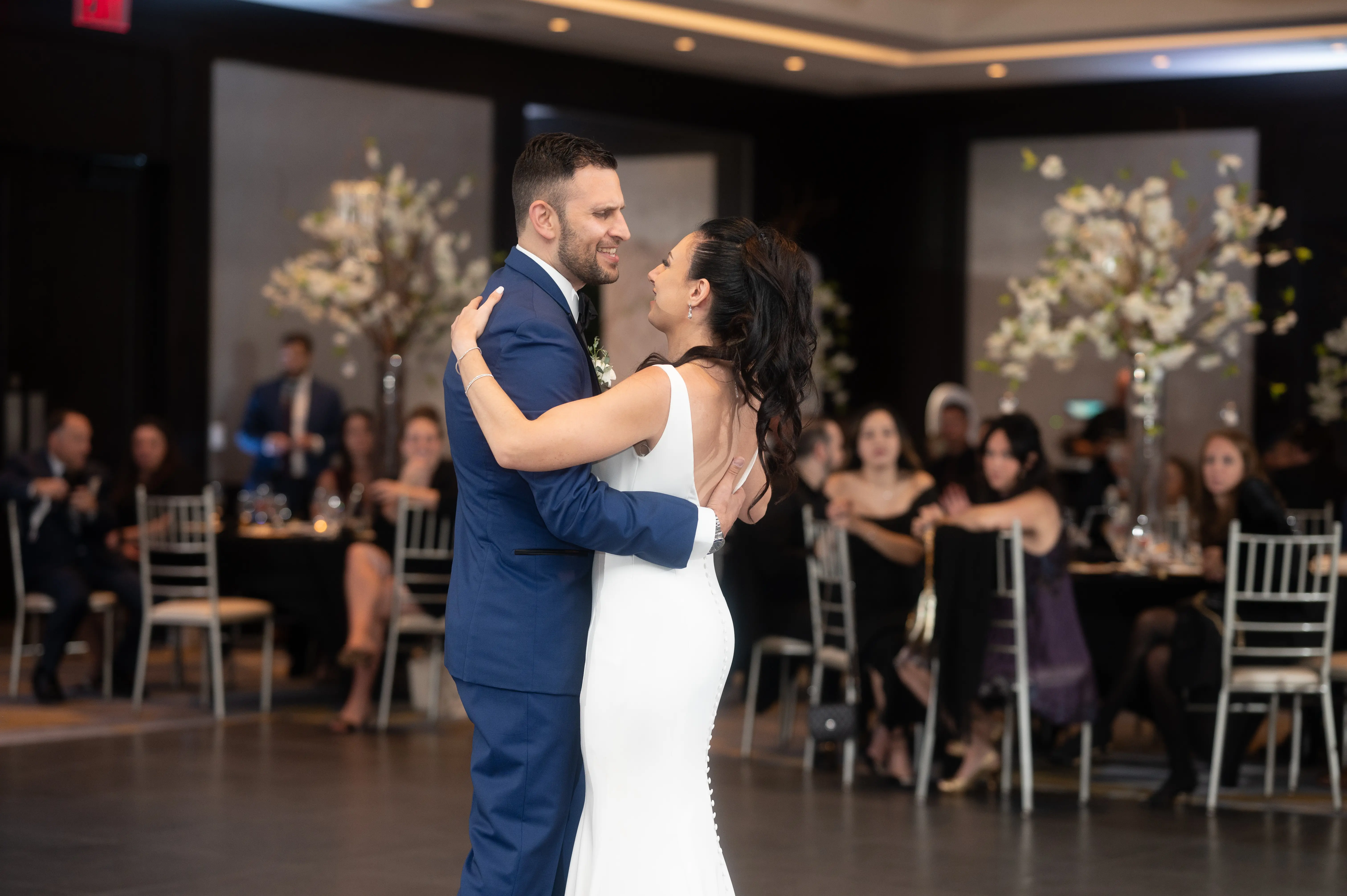 Bride with groom wearing simple fit and flare crepe wedding dress