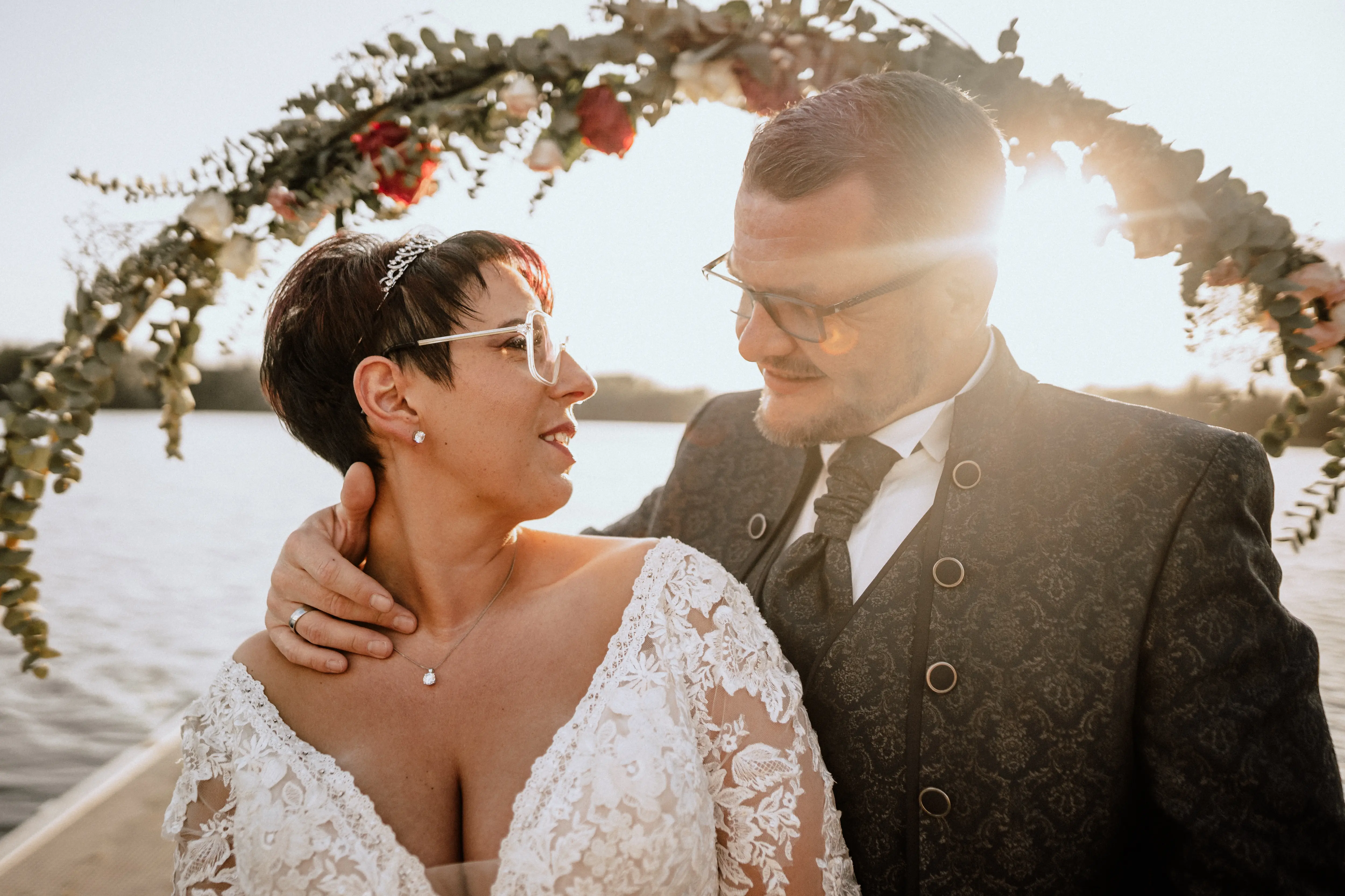 Bride in Long Sleeve Ivory Wedding Dress Raphael with Groom
