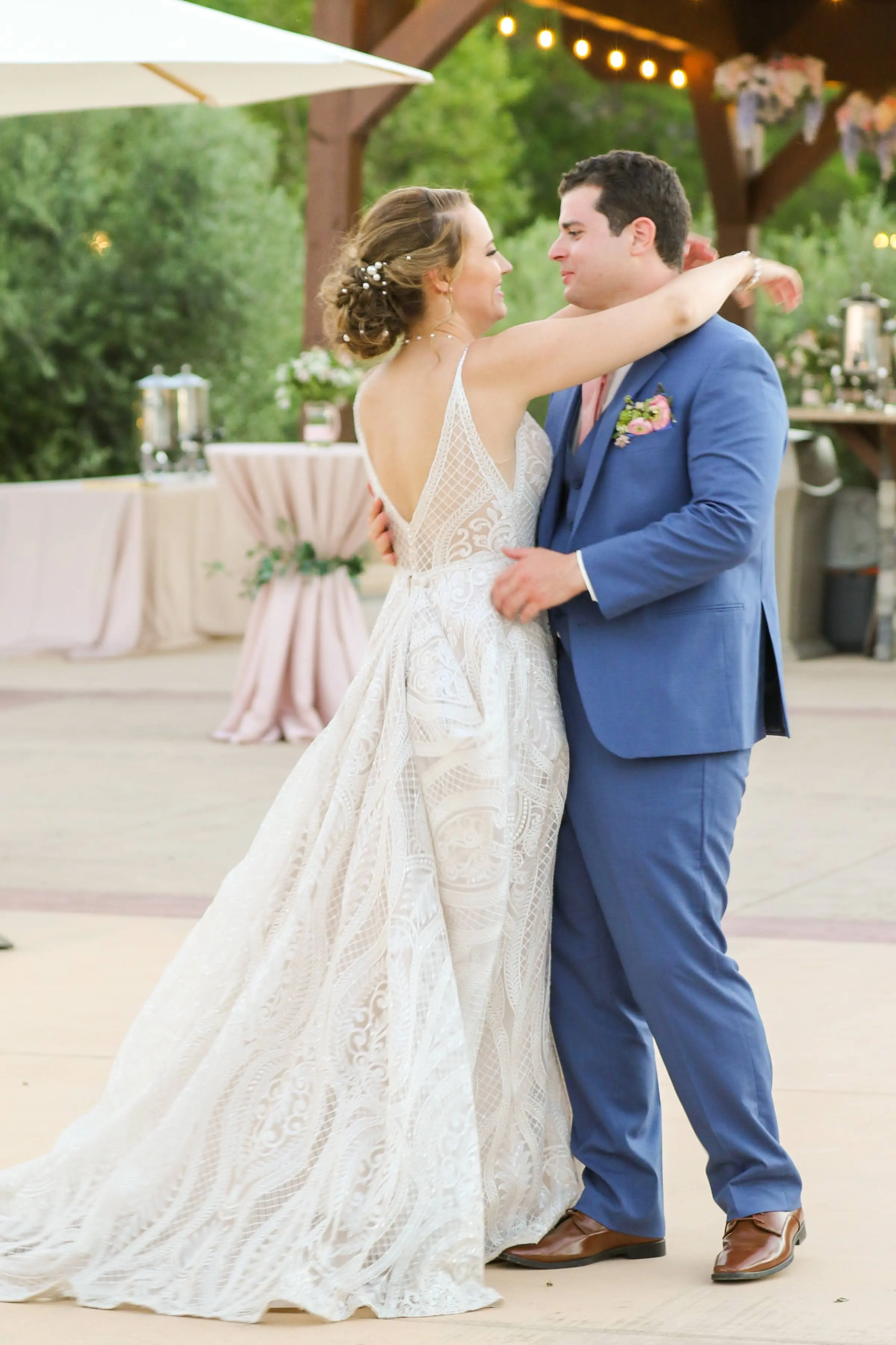 bride in deep illusion v-back  wedding dress called roxanne by sottero and midgley