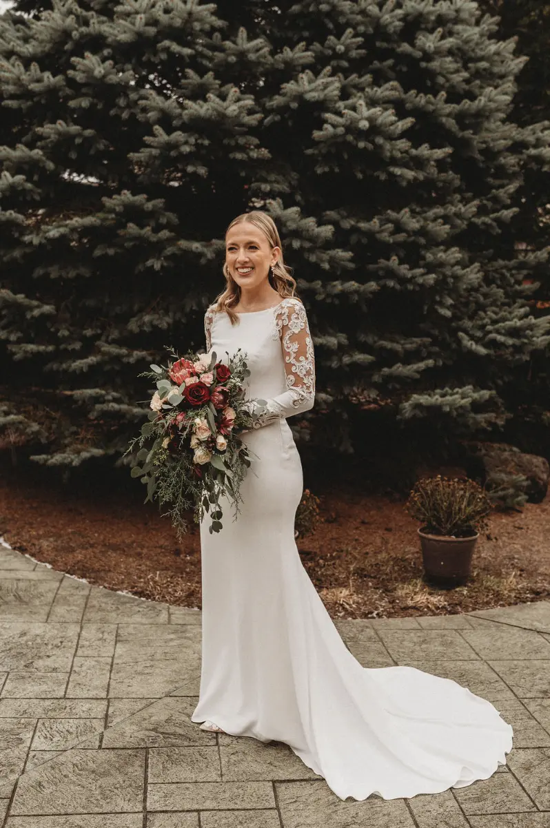Bride in Minimalist Crepe Long Sleeve Lace Sheath Wedding Dress Called Bethany by Rebecca Ingram