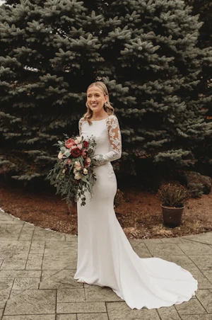 Bride in Minimalist Crepe Long Sleeve Lace Sheath Wedding Dress Called Bethany by Rebecca Ingram