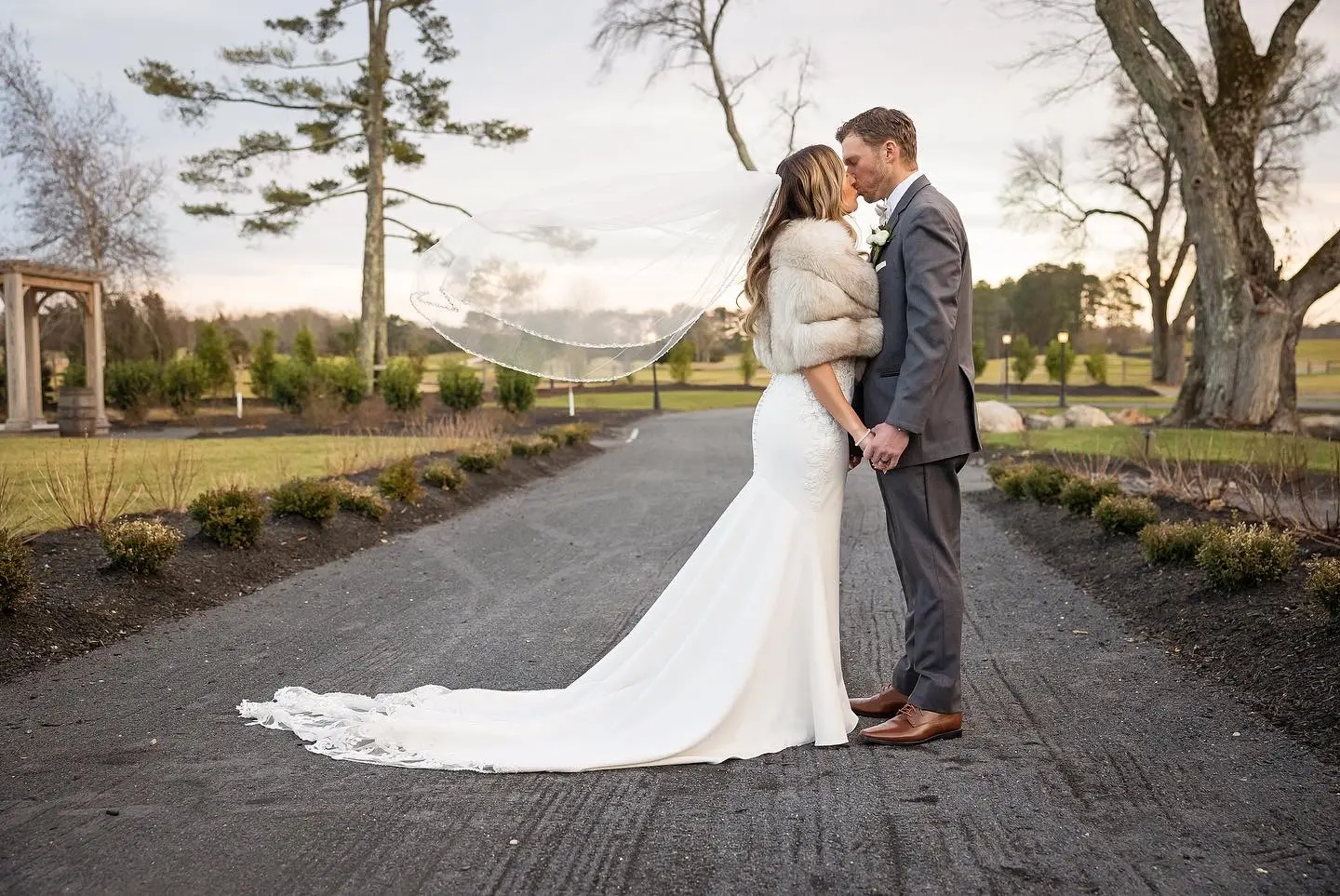 Bride Wearing Lace Mermaid Wedding Gown Called Nikki By Maggie Sottero Kissing Groom
