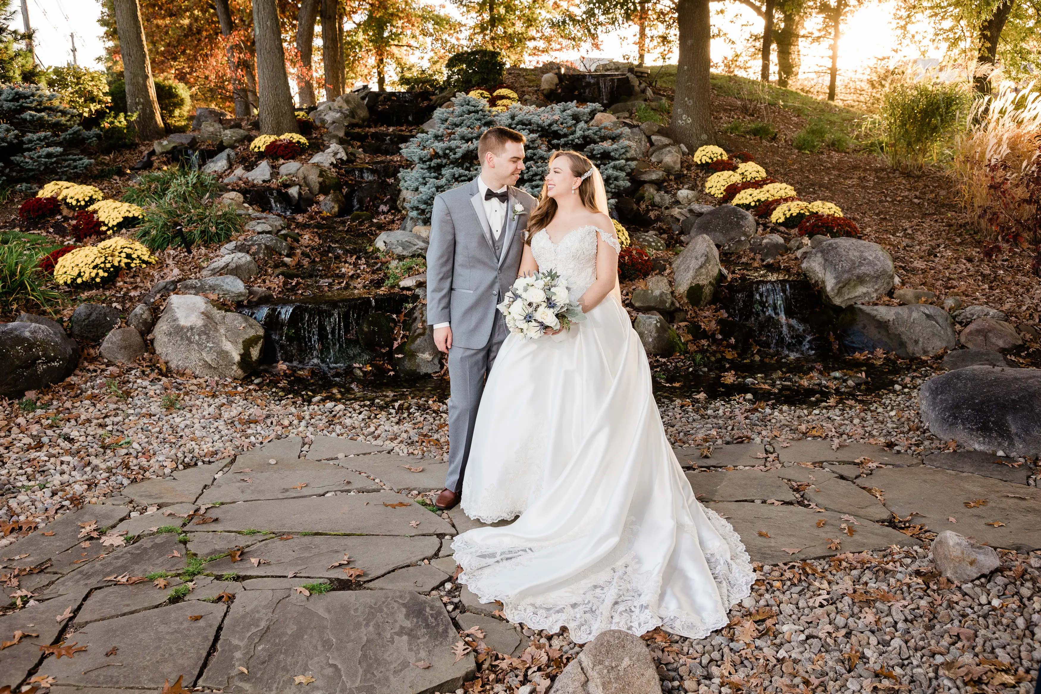 Groom And Bride Wearing Off-The-Shoulder Glamorous Ball Gown Called Kimora By Sottero And Midgley