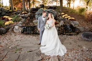 Groom And Bride Wearing Off-The-Shoulder Glamorous Ball Gown Called Kimora By Sottero And Midgley