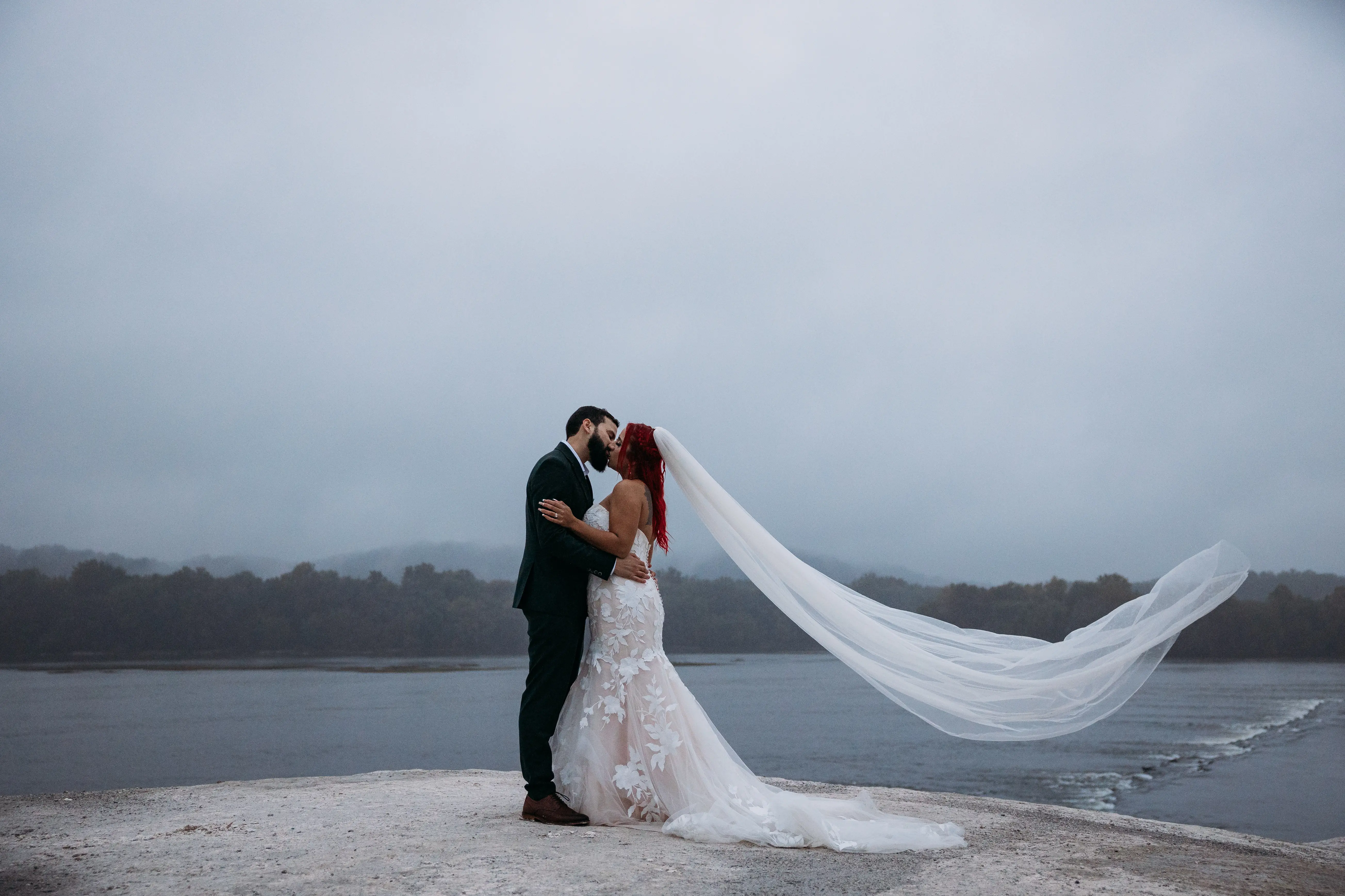 Groom On The Beach With Bride In White Dress Named Hattie By Rebecca Ingram