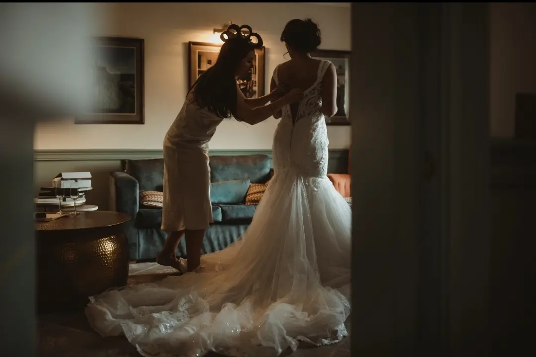 Real Bride in V-Neckline Mermaid Wedding Dress Named Joss by Sottero & Midgley Getting Ready