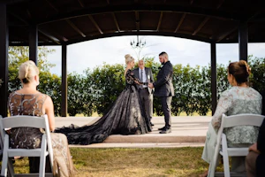 Bride Wearing Black Lace Wedding Dress Called Zander By Sottero And Midgley With Groom At The Ceremony