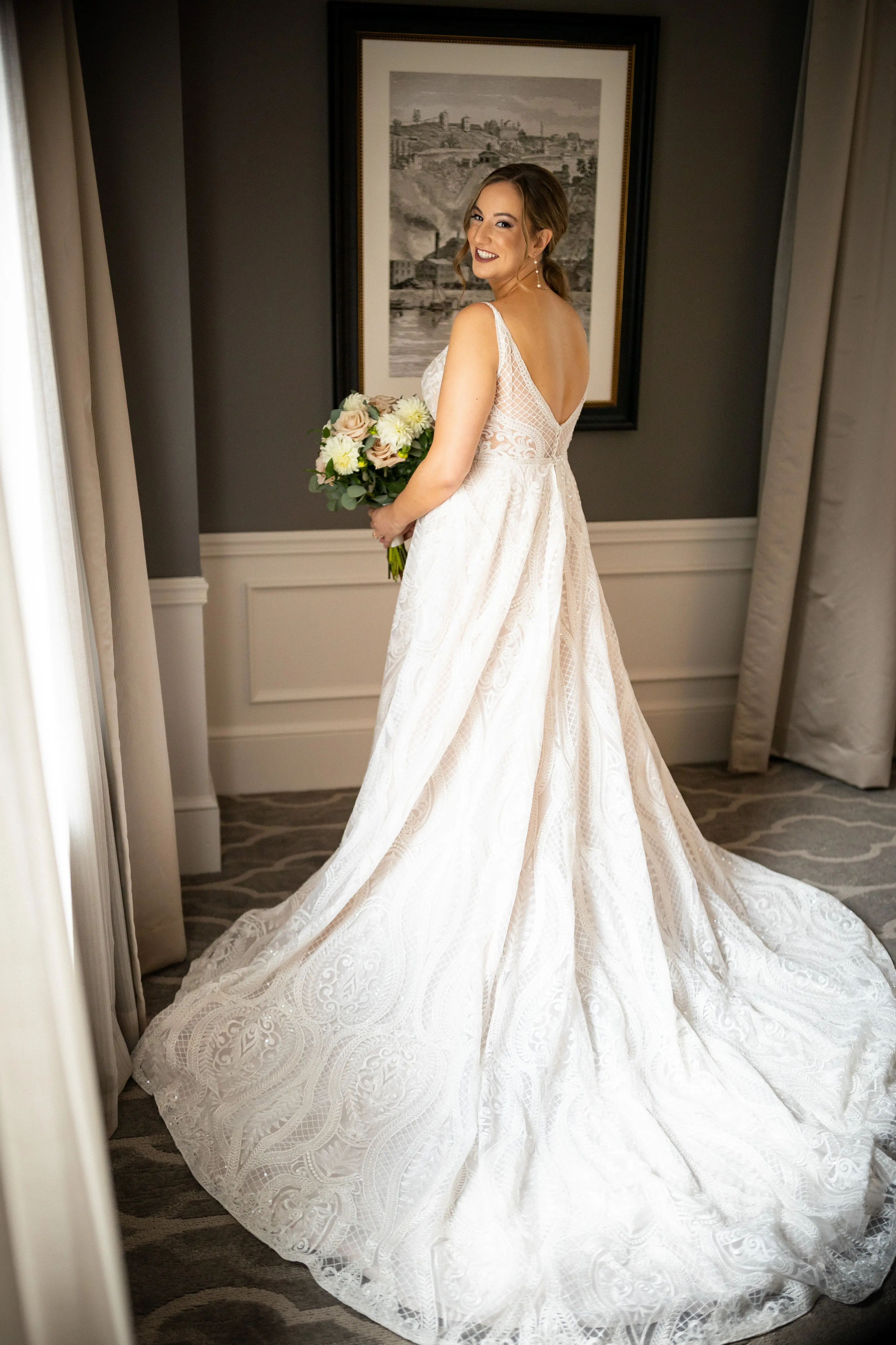 Bride Wearing Glam Princess A-Line Wedding Dress Called Roxanne By Sottero And Midgley