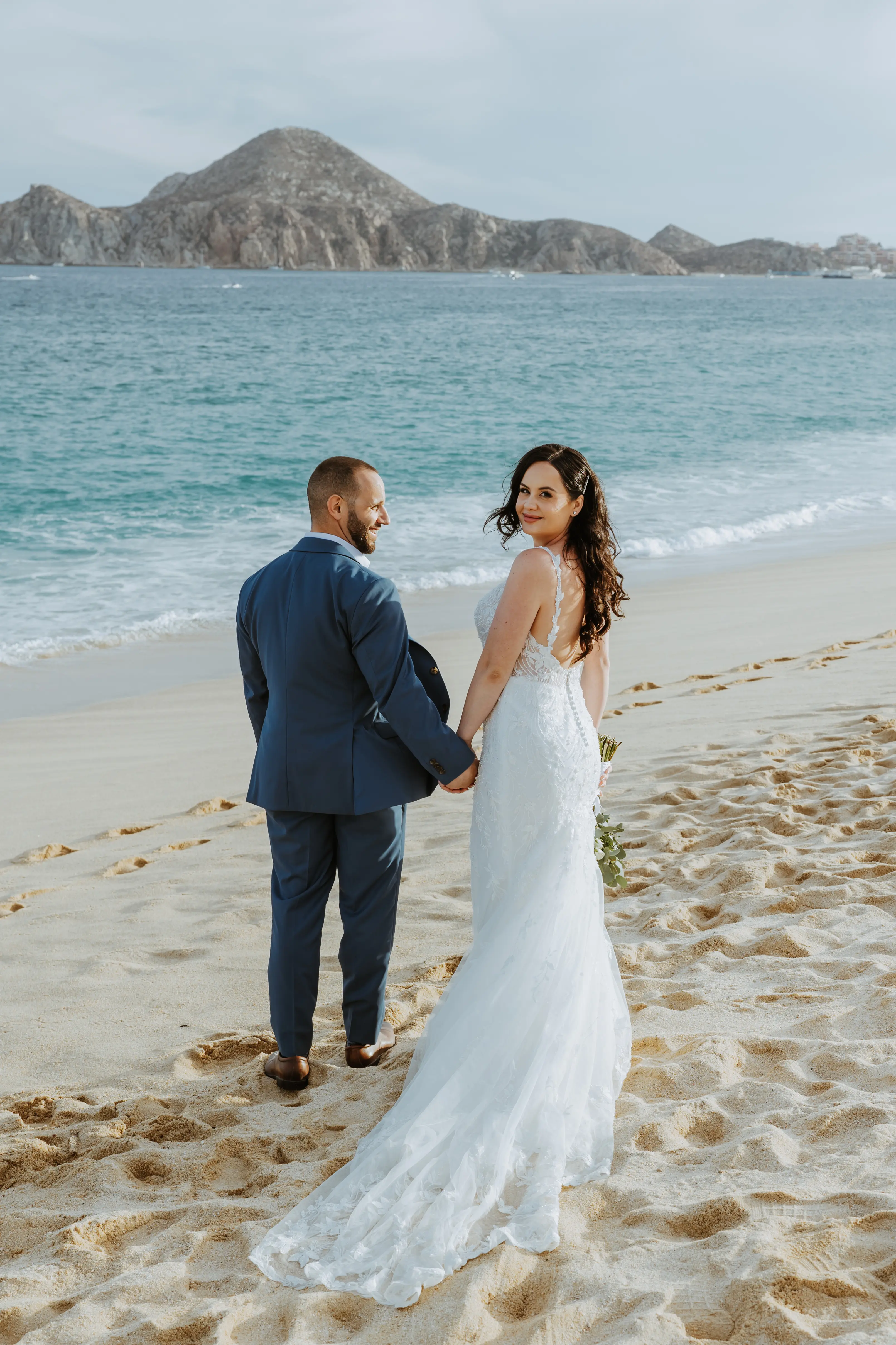 Groom On Beach With Bride In A White Beaded Wedding Dress Named Jonah Lane By Sottero And Midgley