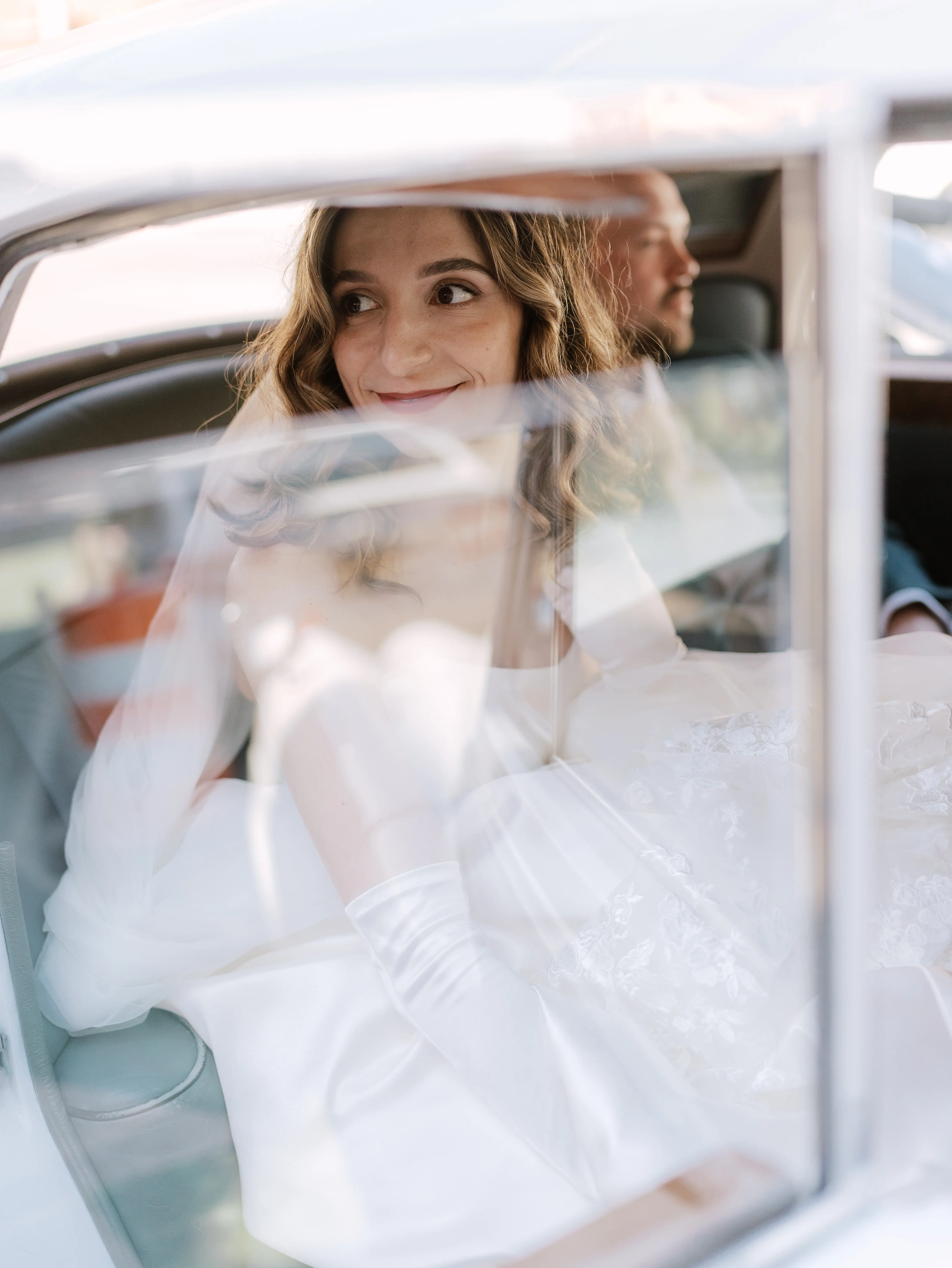 Bride wearing Selena by Maggie Sottero in the car