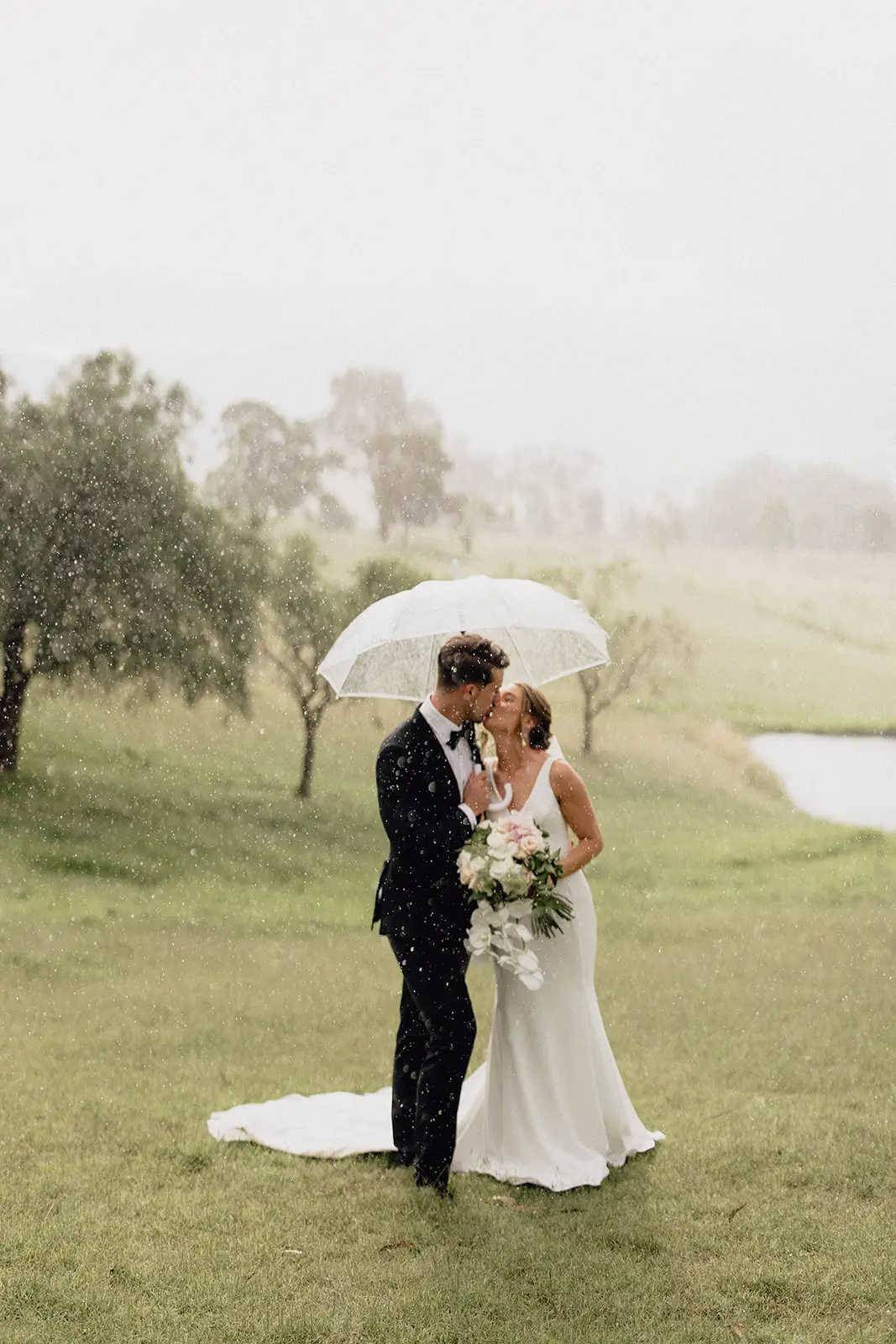 Groom With Bride Wearing Minimalist Crepe Fit-And-Flare Wedding Dress Fernanda By Maggie Sottero