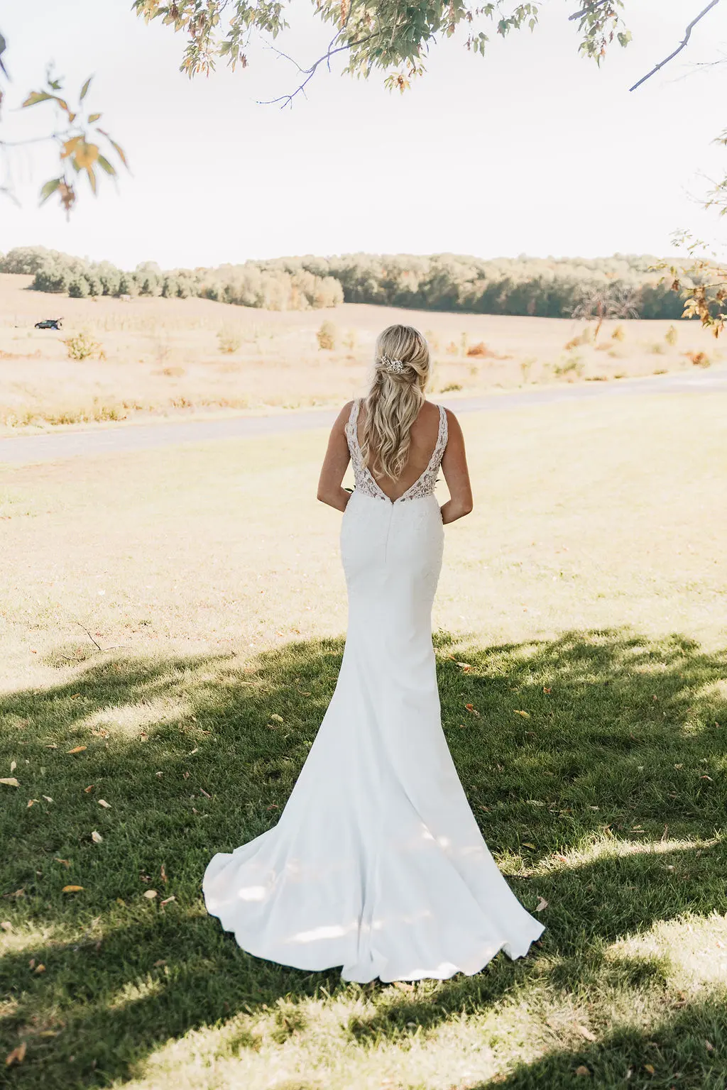 Bride wearing wedding dress called Carmen.