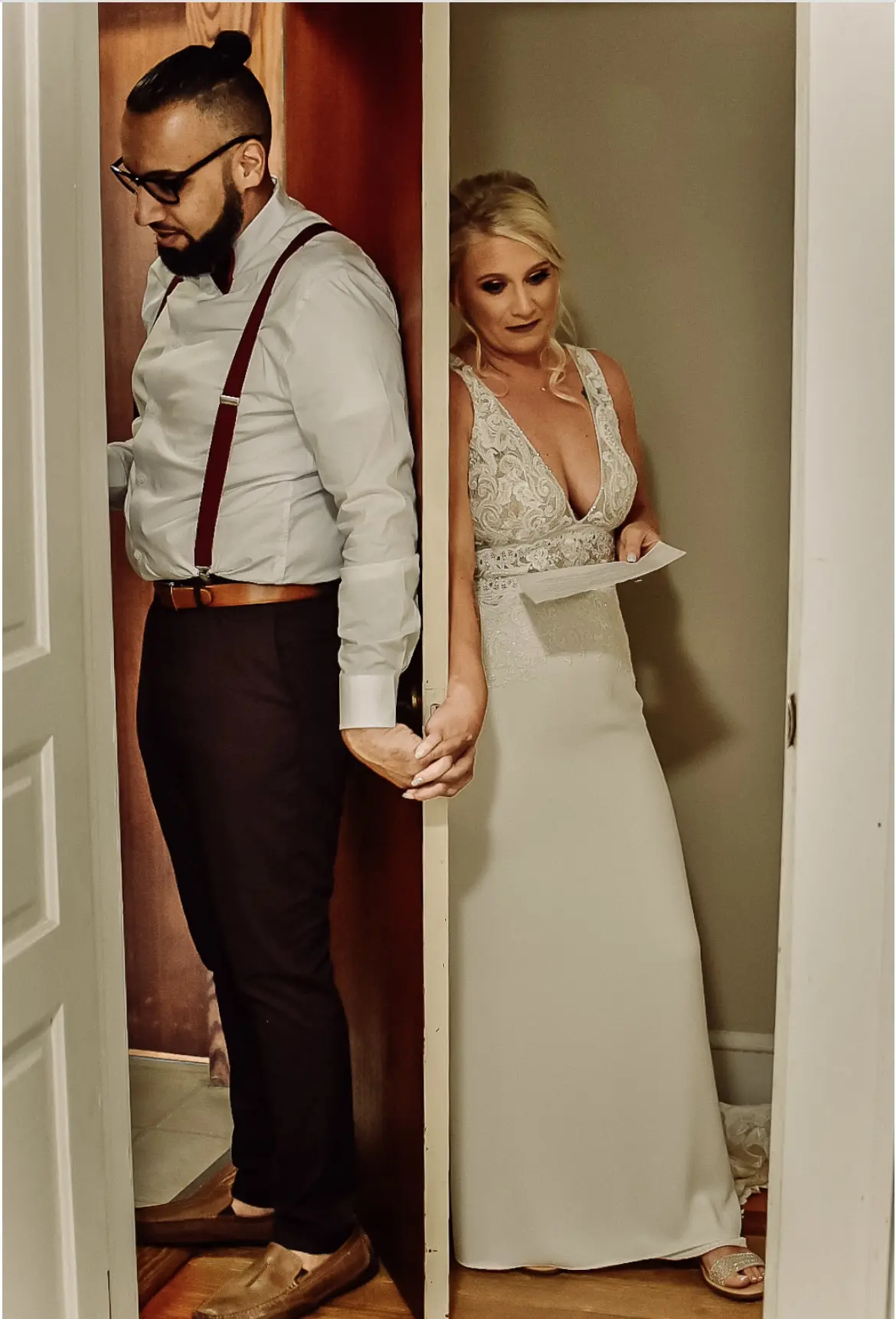 Groom and Bride Sharing Notes before the Ceremony Wearing Aidan Lace Sheath Bridal Dress Called Aidan By Maggie Sottero